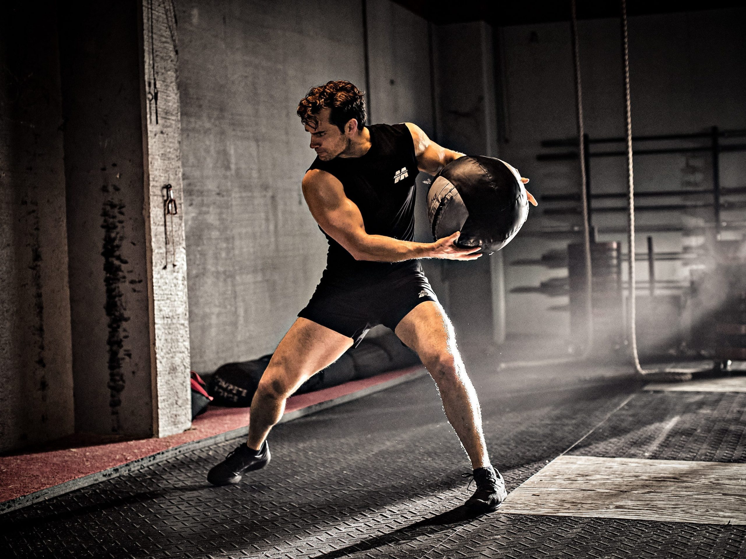 Henry Cavill throwing a weighted ball.