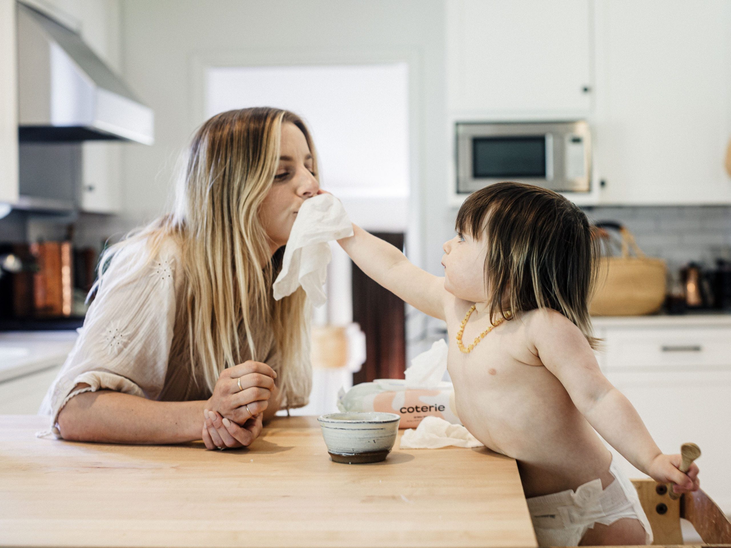 Mom and baby with Coterie wipes