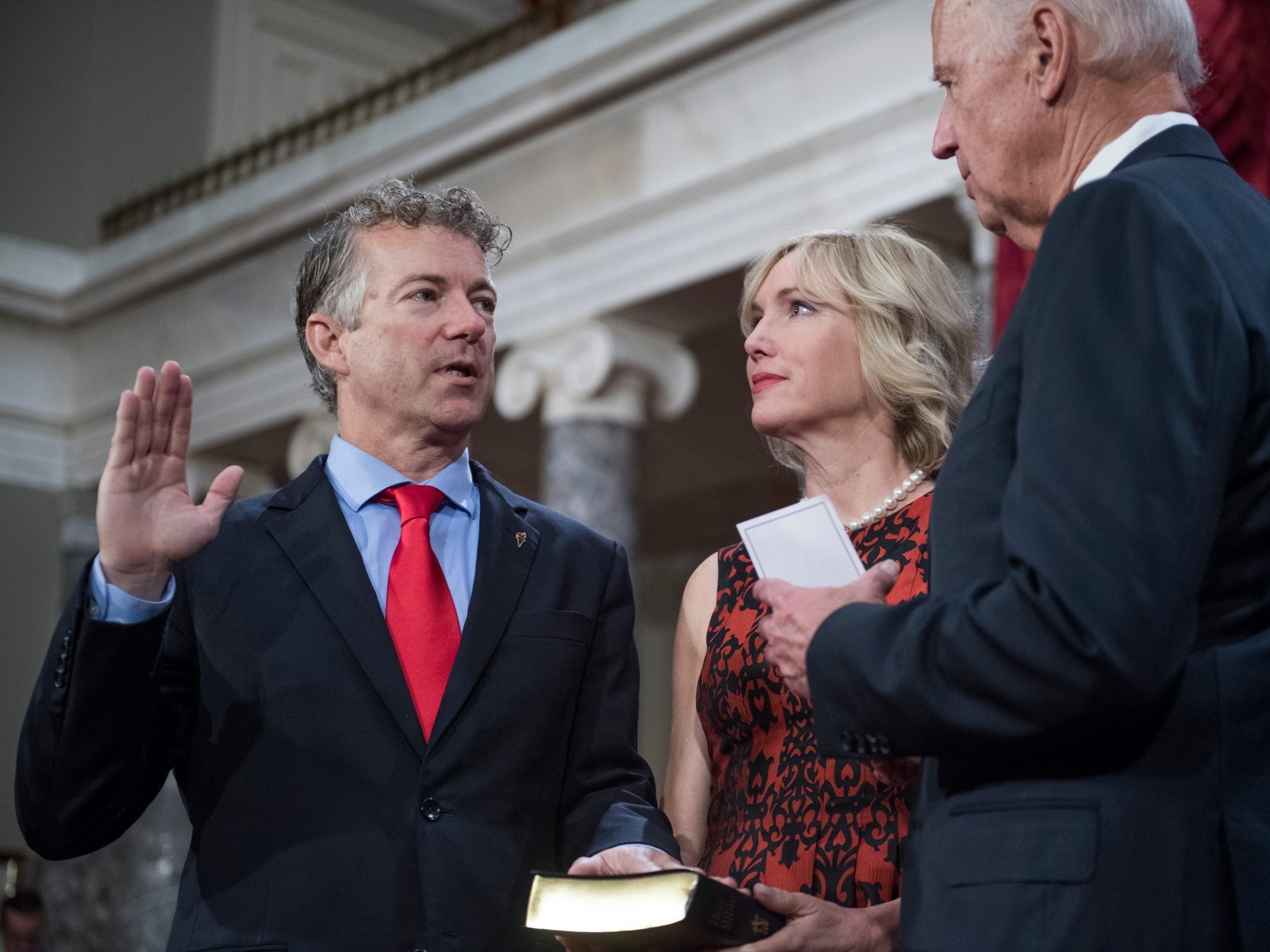 Sen. Rand Paul is administered an oath as his wife Kelley looks on during a swearing-in ceremony in the US Capitol on Jan 3, 2017.