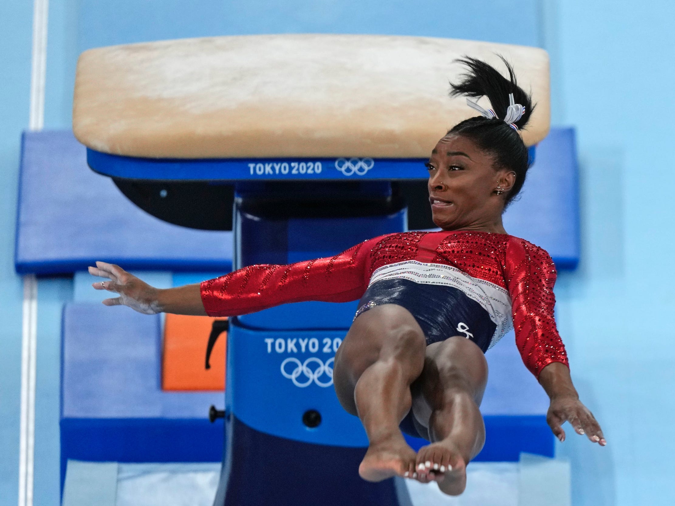 Simone Biles vaults at the Tokyo Olympics.