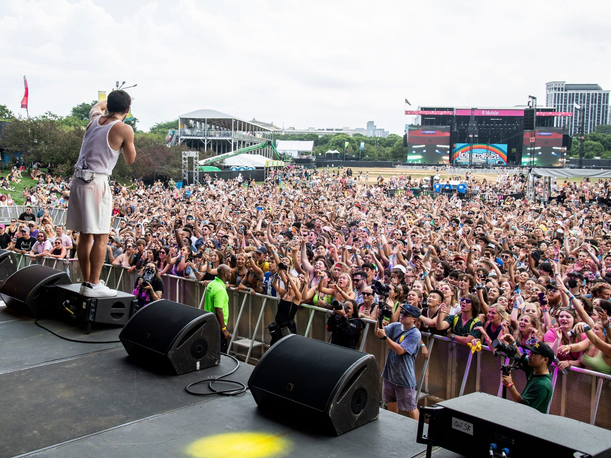 A singer performs in front of a packed crowd.