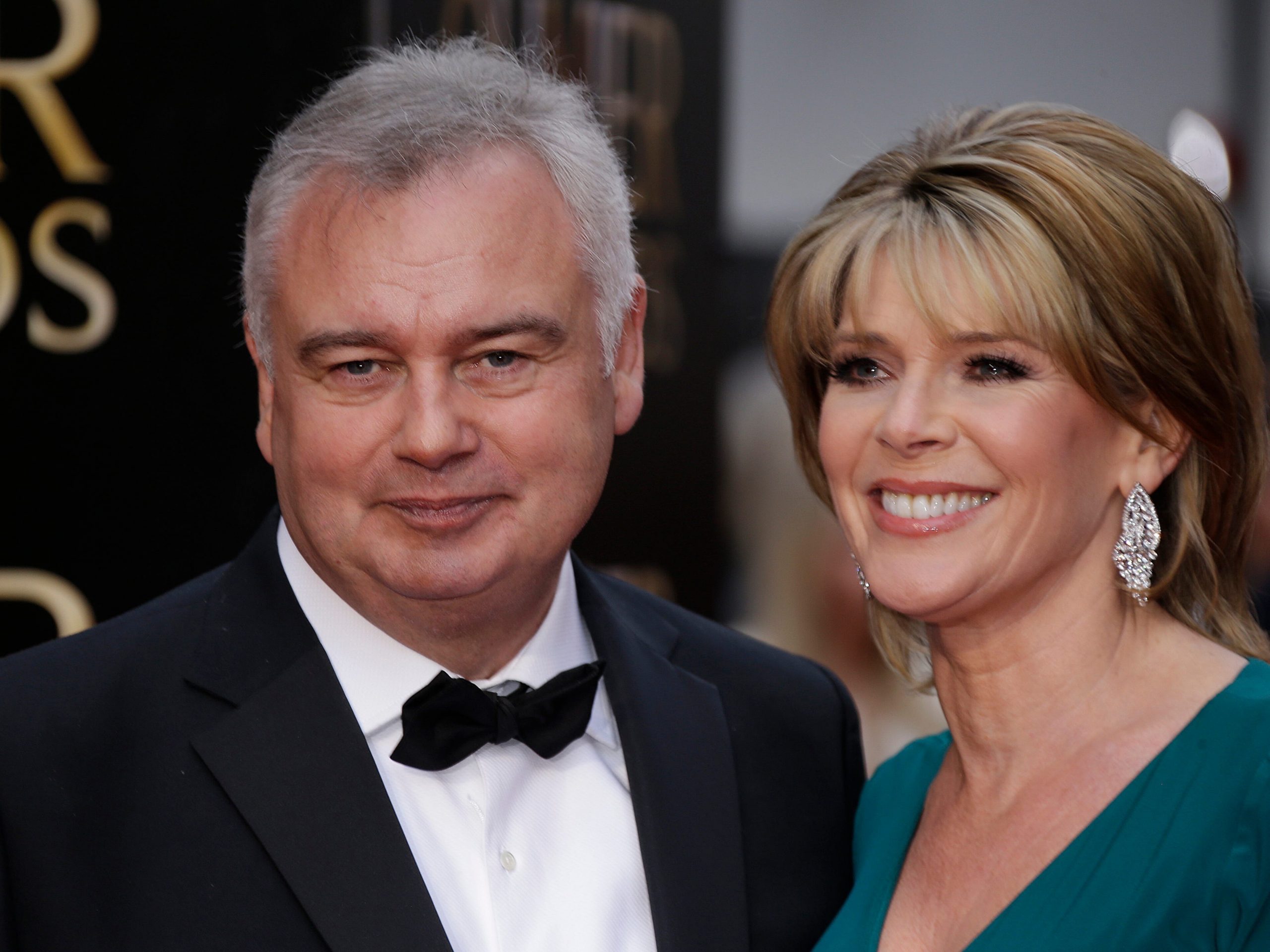 Eamonn Holmes and and wife Ruth Langsford pose for photographers upon arrival at the Olivier Awards at the Royal Opera House in central London, Sunday, April 12, 2015.