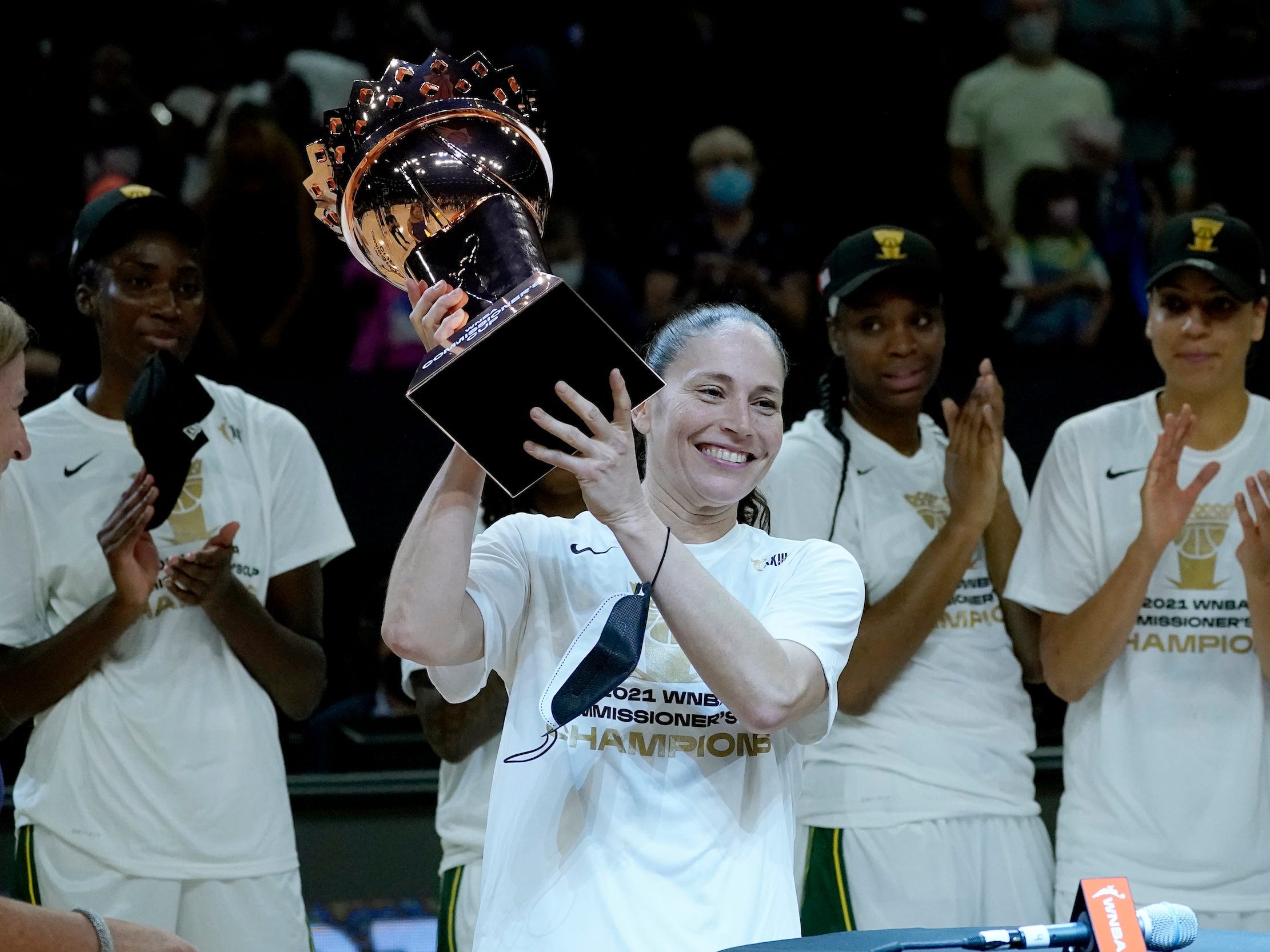 Sue Bird hoists the inaugural WNBA Commissioner's Cup.