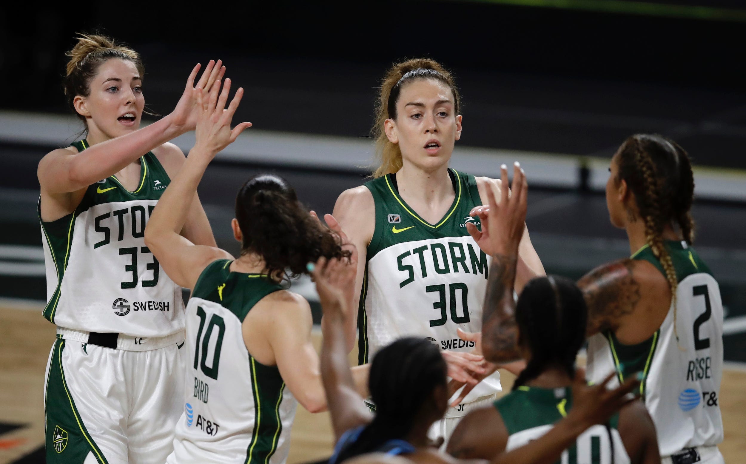 Seattle Storm players huddle up.