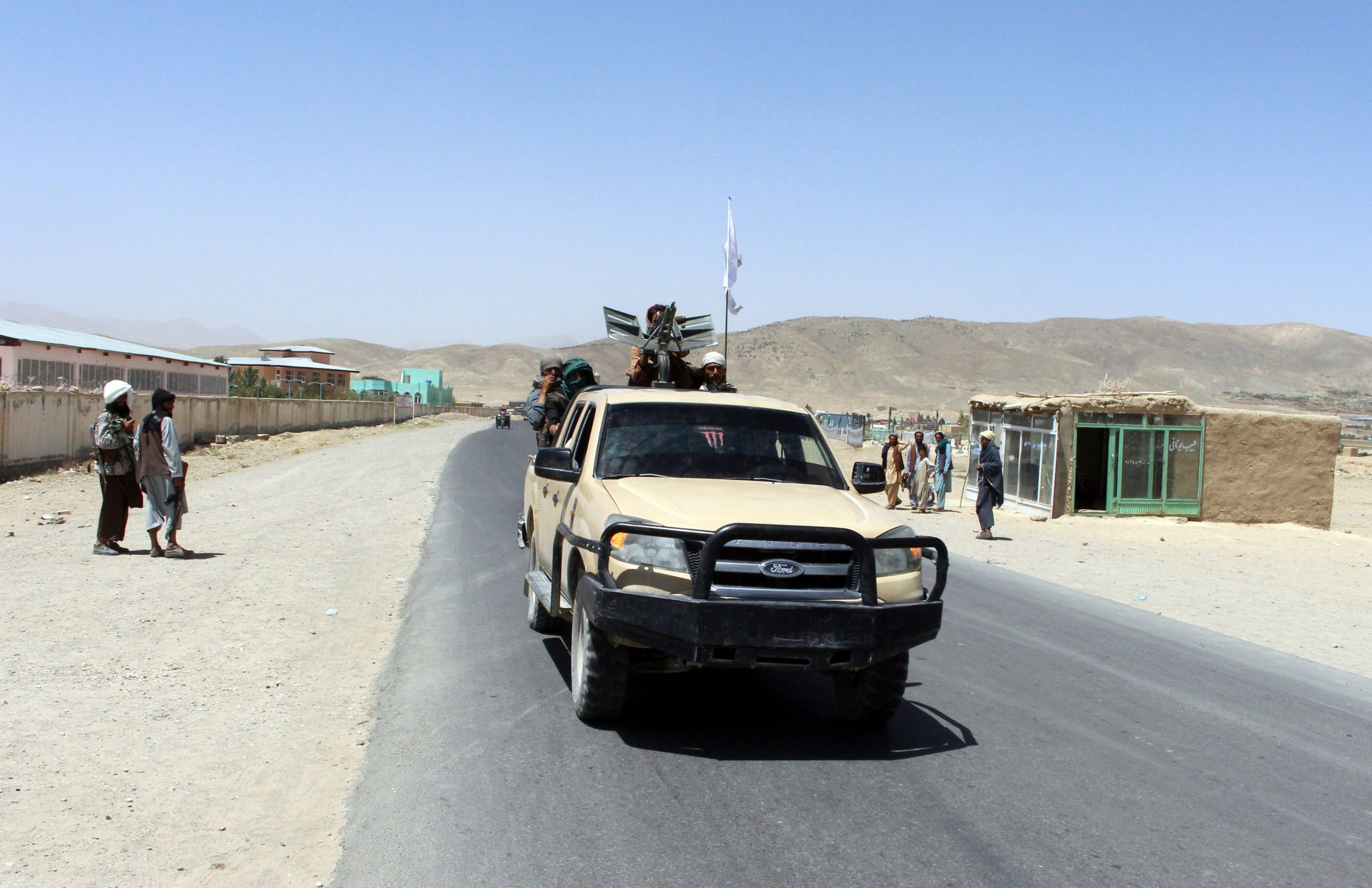 Taliban fighters patrol inside the city of Ghazni, southwest of Kabul, Afghanistan, Friday, Aug. 13, 2021