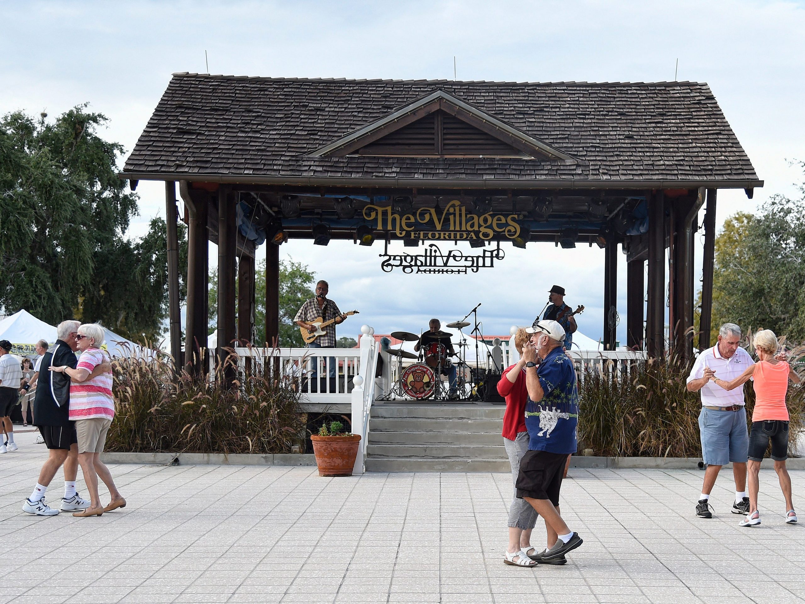 Residents dance in the square of The Villages retirement community in 2016.