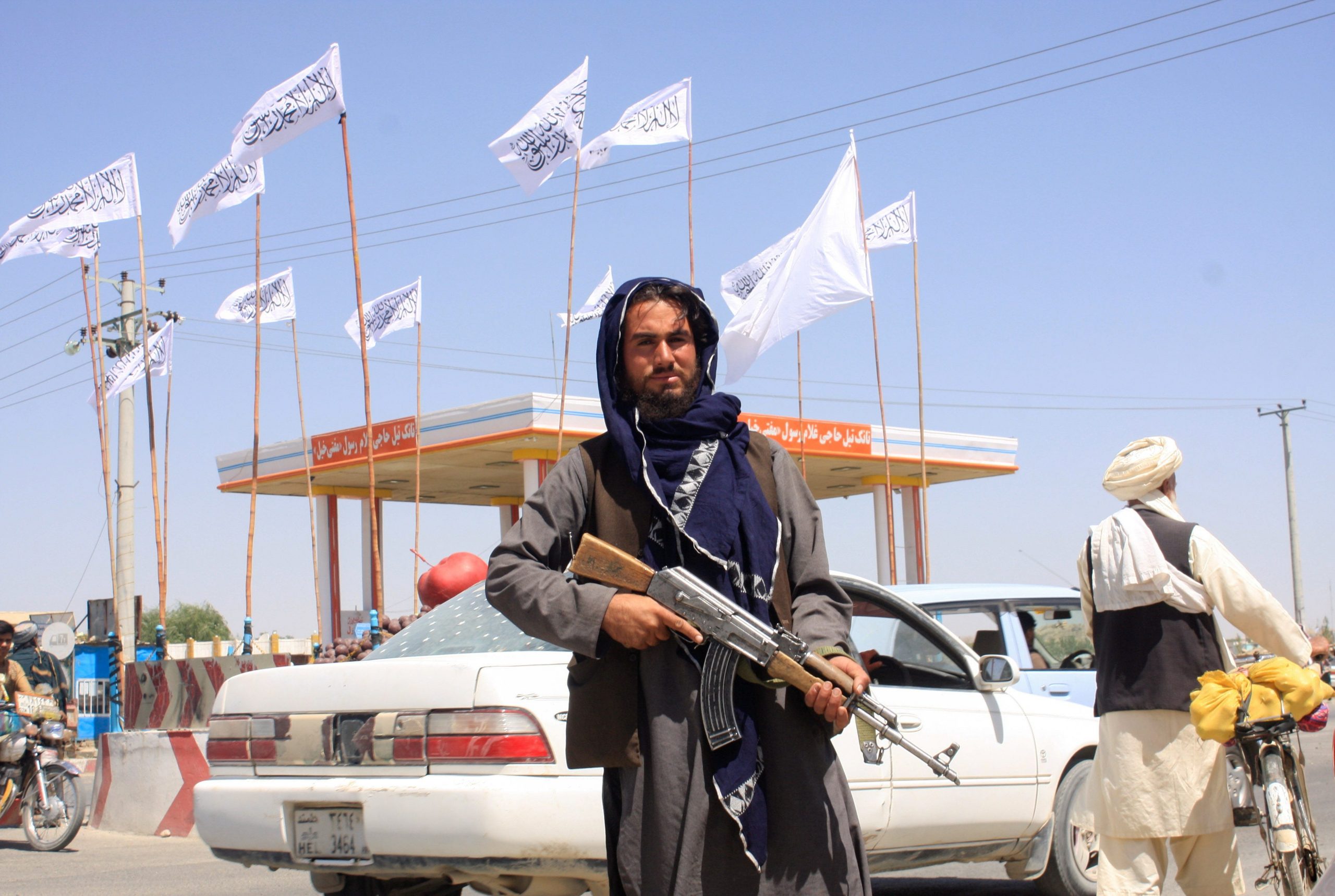 A Taliban fighter looks on as he stands at the city of Ghazni, Afghanistan.