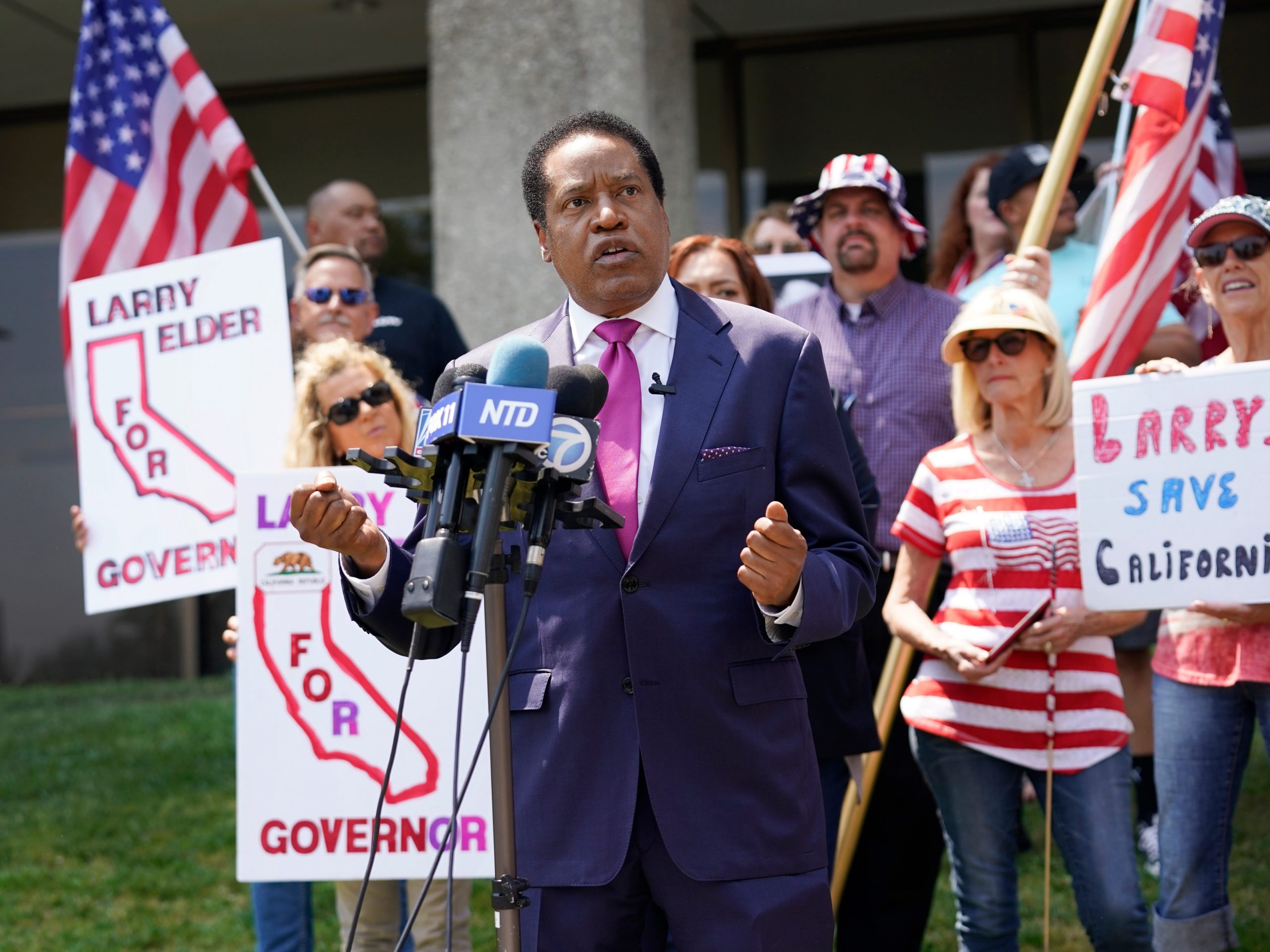 In this July 13, 2021 file photo radio talk show host Larry Elder speaks to supporters during a campaign stop in Norwalk, Calif.