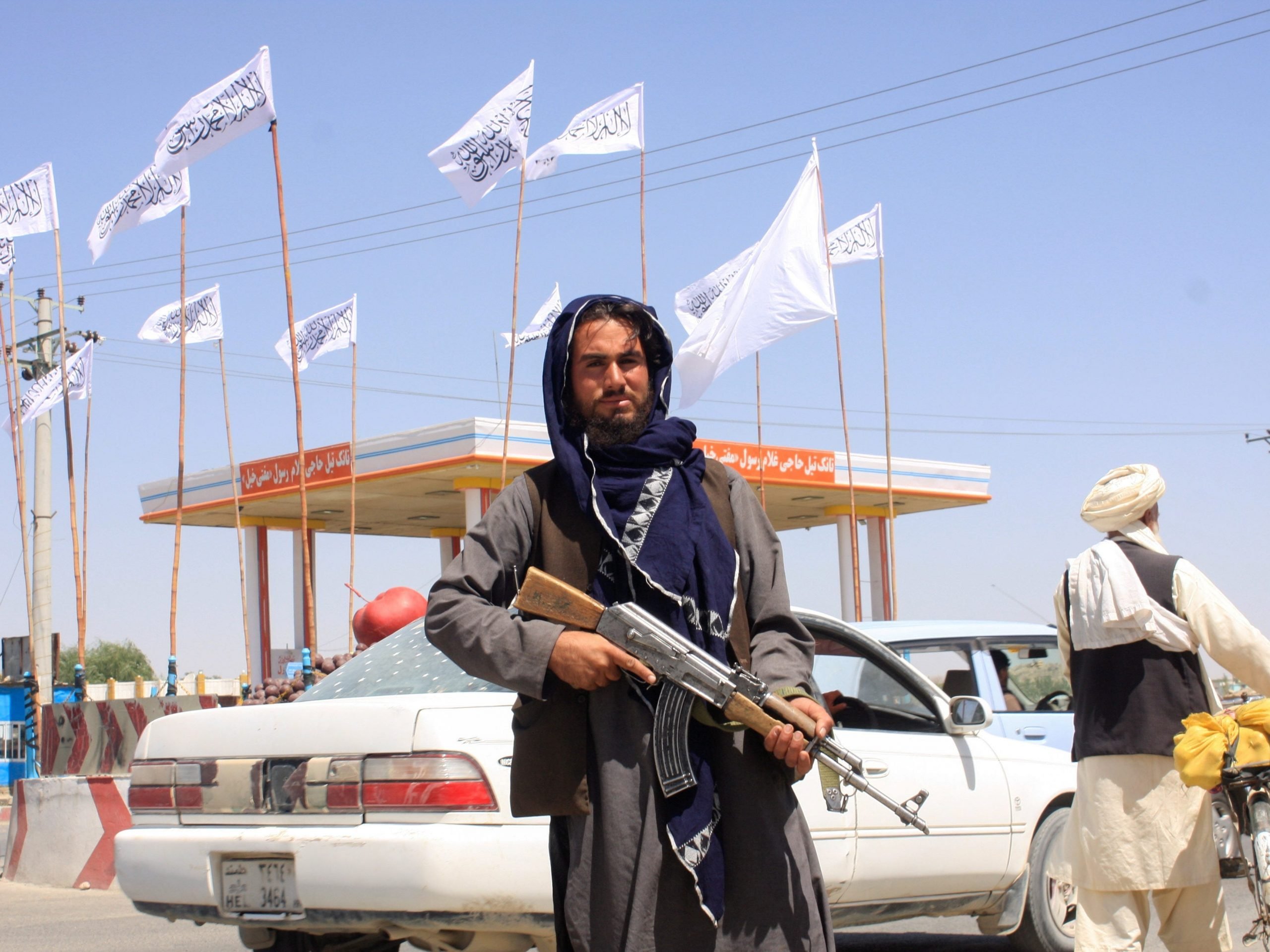 A Taliban fighter looks on as he stands at the city of Ghazni, Afghanistan.