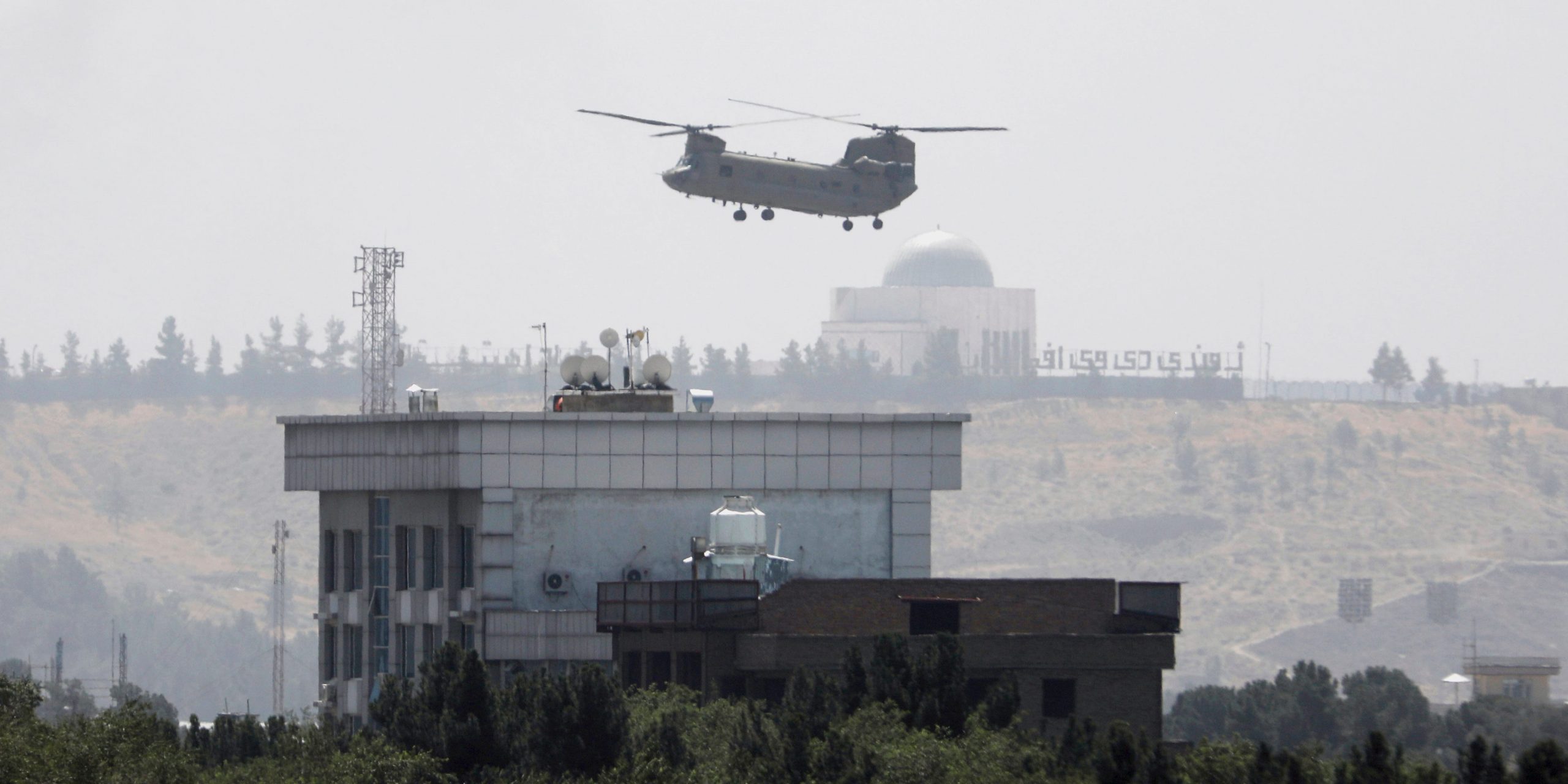 A U.S. Chinook helicopter flies near the U.S. Embassy in Kabul, Afghanistan, Sunday, Aug. 15, 2021.