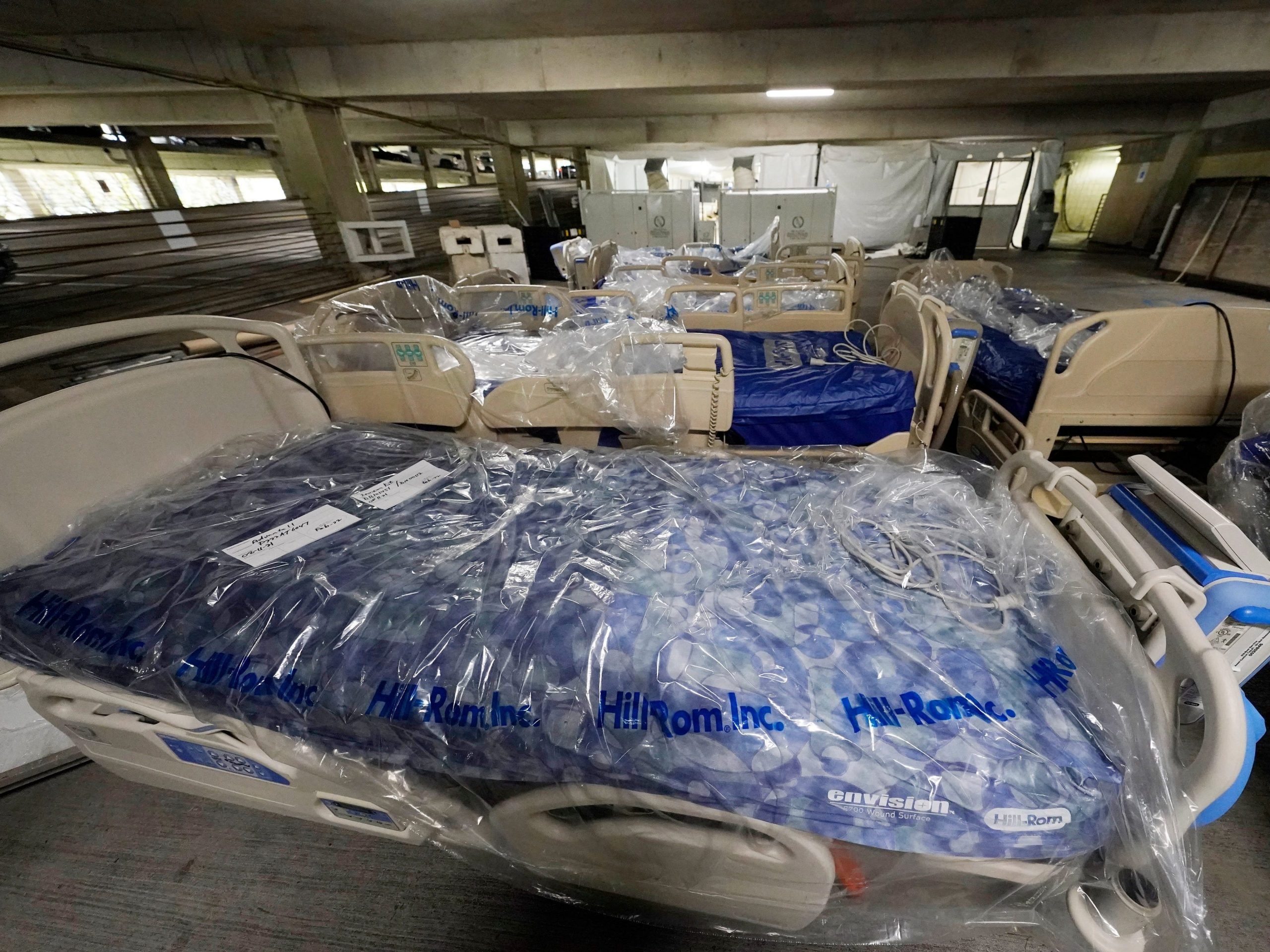 Beds await placement in a yet to be completed section of a COVID-19 mobile field hospital erected in a parking garage at the University of Mississippi Medical Center in Jackson, Miss., Thursday, Aug. 12, 2021. The field unit will have a mixture of inpatient and outpatient services and will be a resource for the entire state, not just UMMC, and will be staffed by members of the National Disaster Medical System, a team of 36 federal medical professionals.