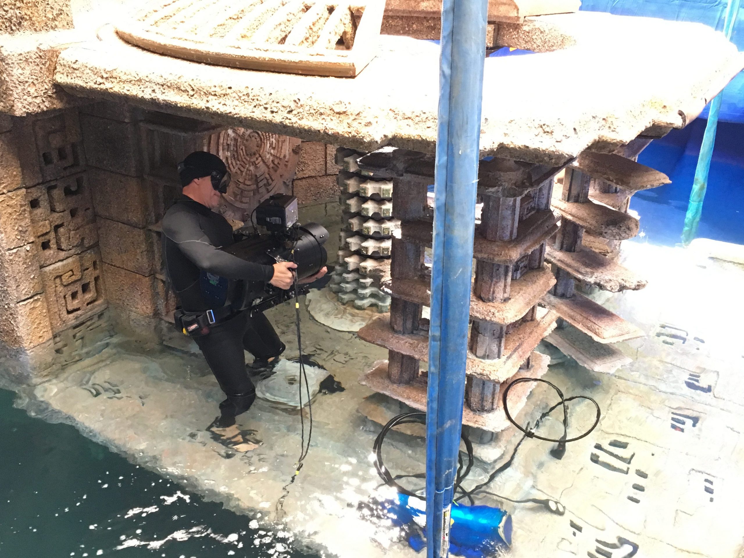 Ian Seabrook holding camera as set rises from the water