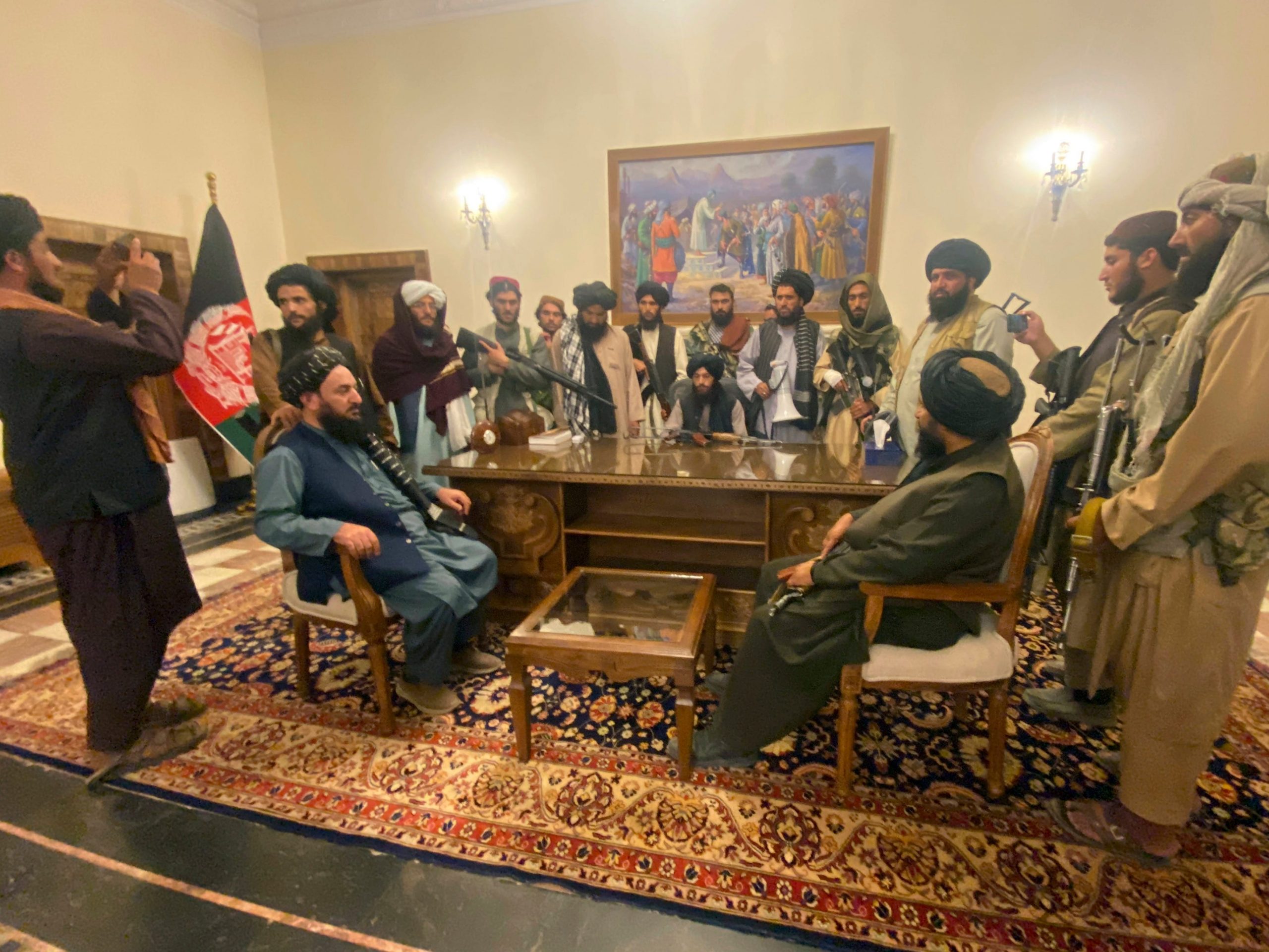 Taliban fighters take control of Afghan presidential palace after the Afghan President Ashraf Ghani fled the country, in Kabul, Afghanistan, Sunday, Aug. 15, 2021.