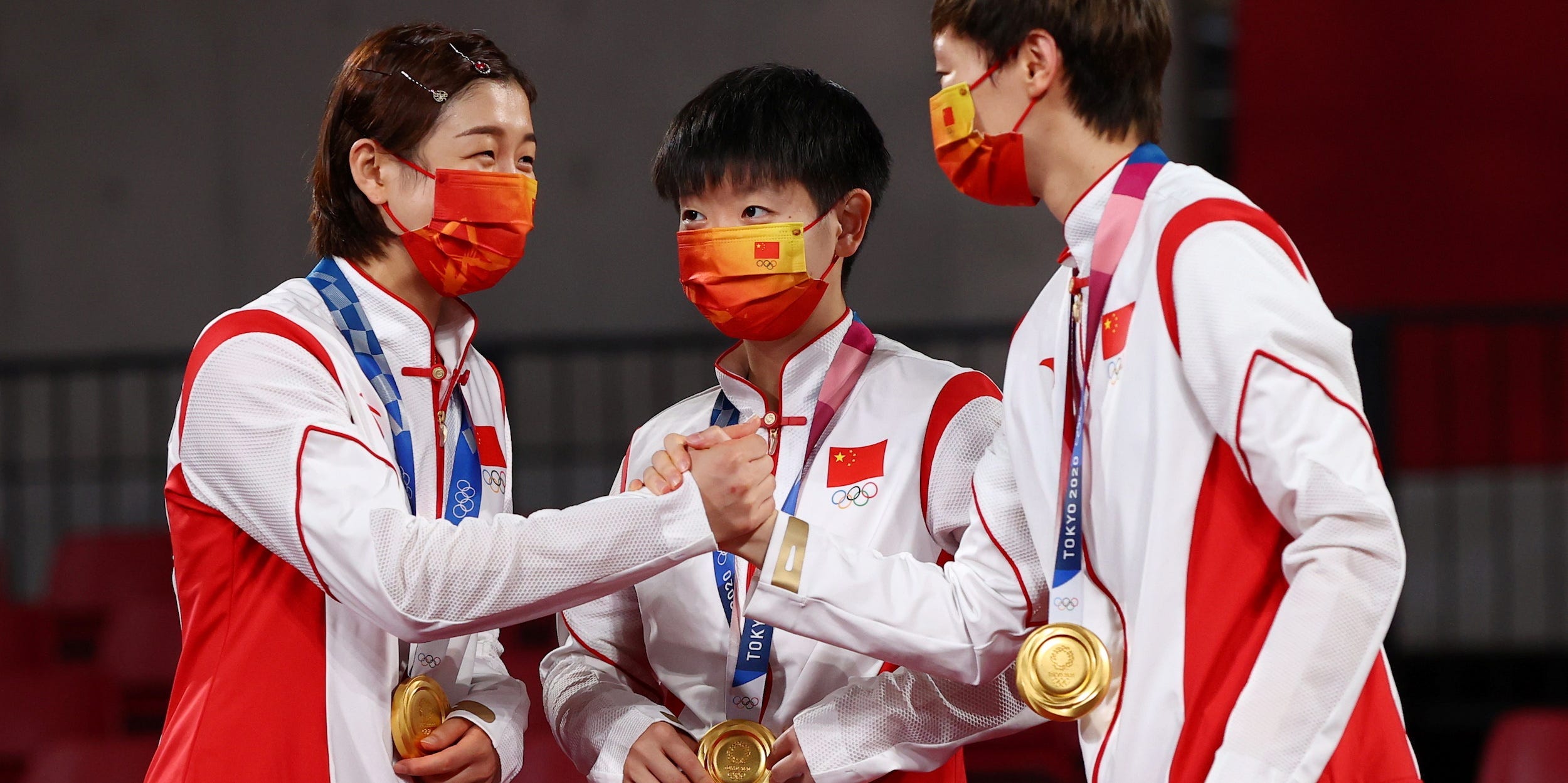 Gold medallists Chen Meng of China, Wang Manyu of China and Sun Yingsha of China on the podium at Tokyo