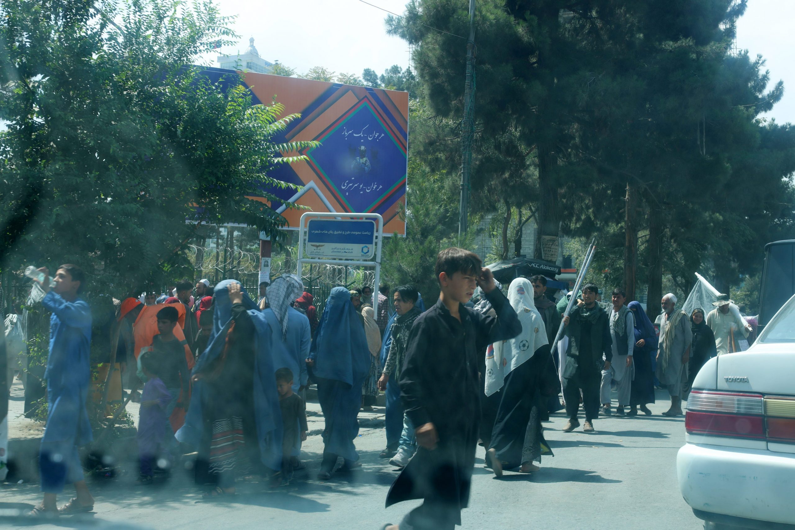 refugees crowd into a makeshift camp in kabul