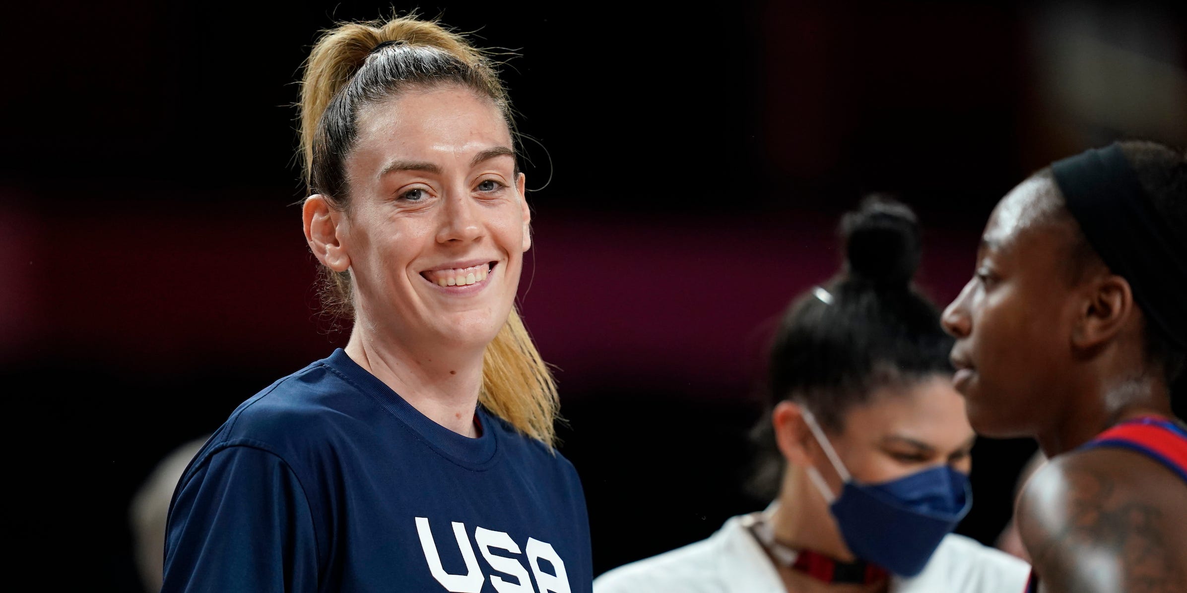 United States's Breanna Stewart laughs with teammates at the end of a women's basketball quarterfinal round game against Australia at the 2020 Summer Olympics, Wednesday, Aug. 4, 2021, in Saitama, Japan.
