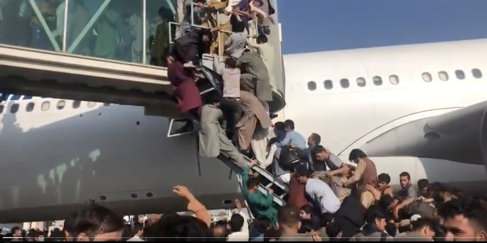 Video shows people trying to force their way onto a plane at Kabul airport.