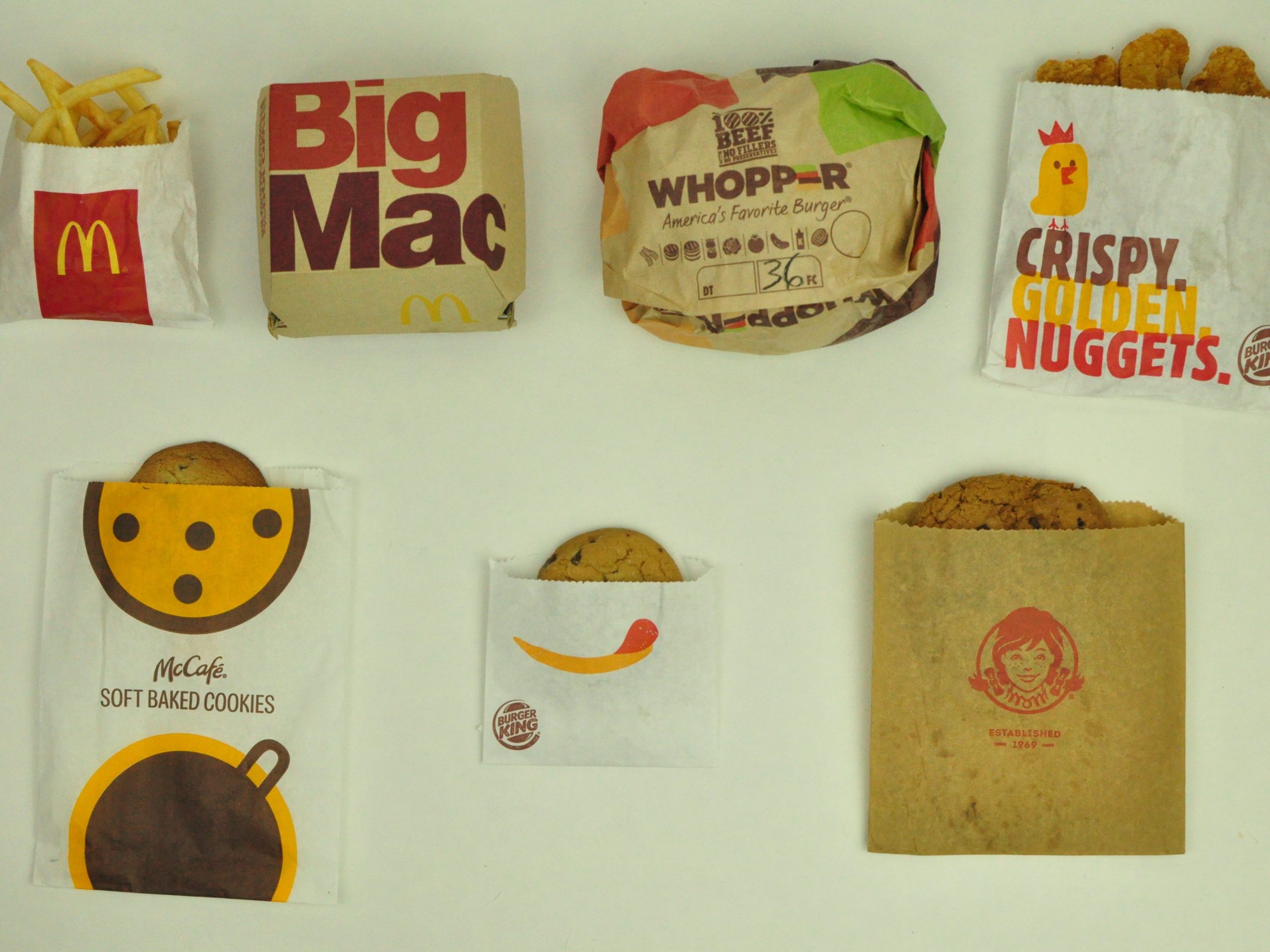 fast food in packaging laid out on a table