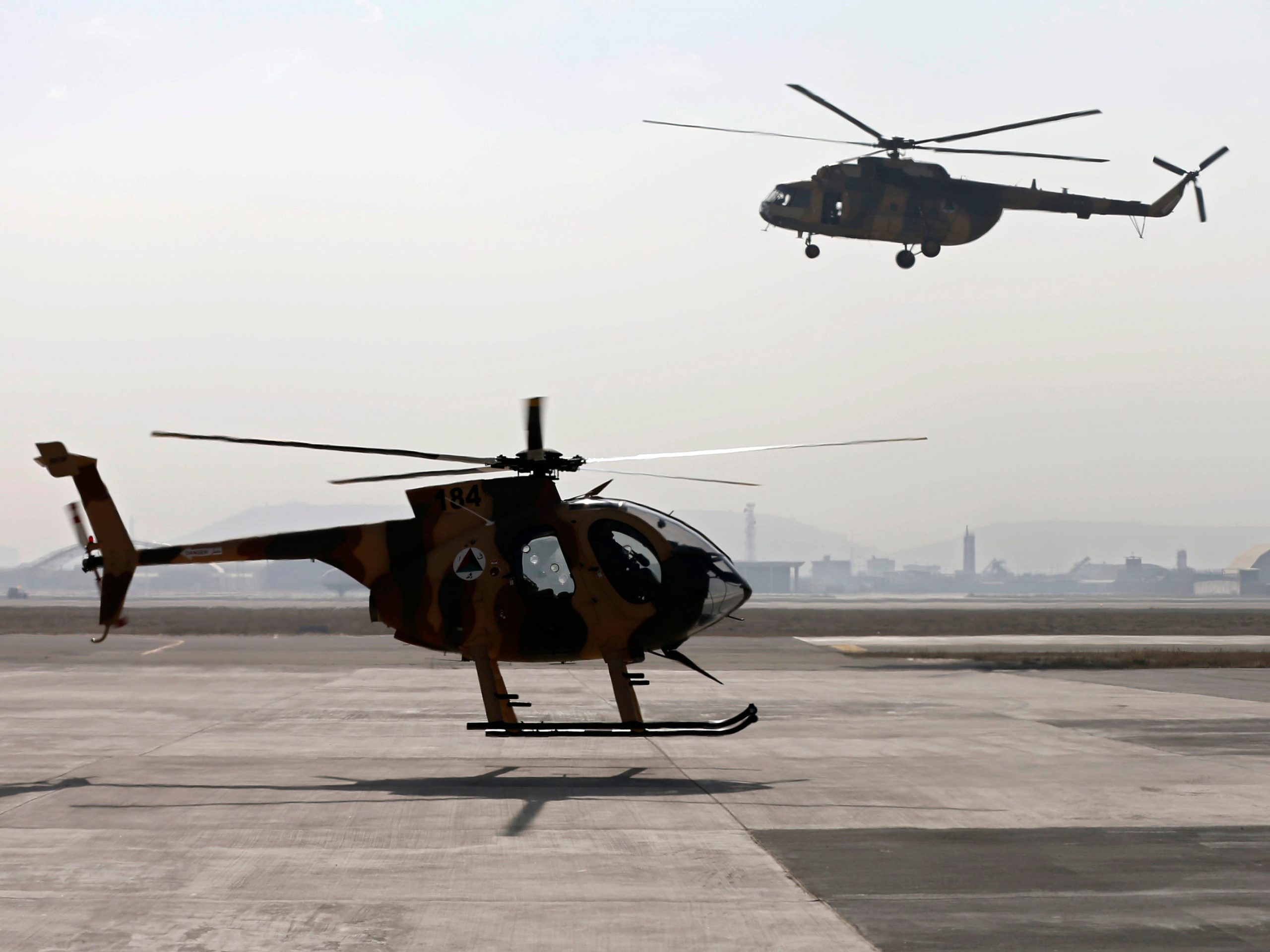 This 2014 photo shows Afghan Air Force helicopters landing at the military airport in Kabul.