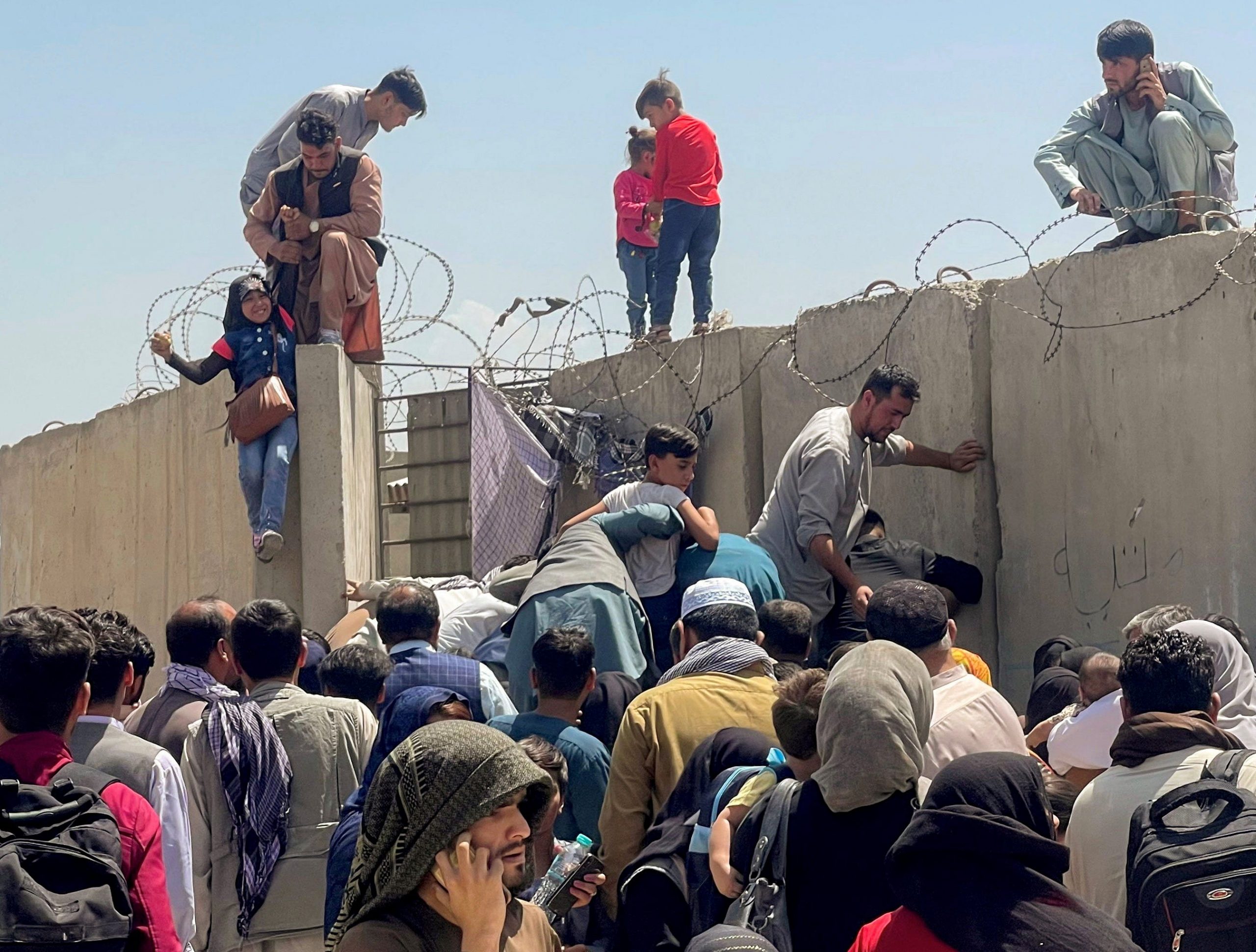 Thousands try to flee Afghanistan after the Taliban takes control.