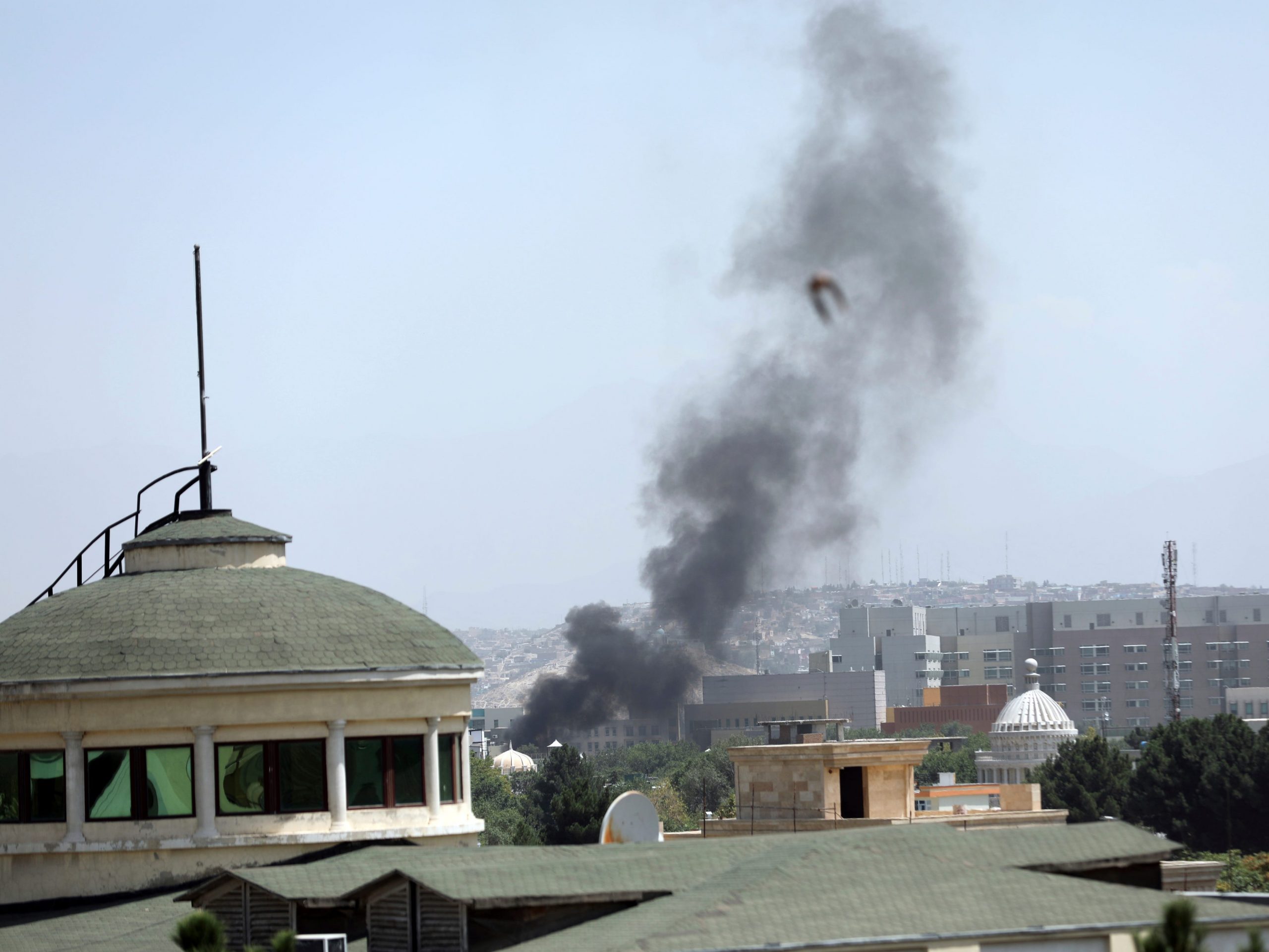 Smoke rises next to the U.S. Embassy in Kabul, Afghanistan, Sunday, August 15, 2021. Wisps of smoke could be seen near the embassy's roof as diplomats urgently destroyed sensitive documents, according to two American military officials.