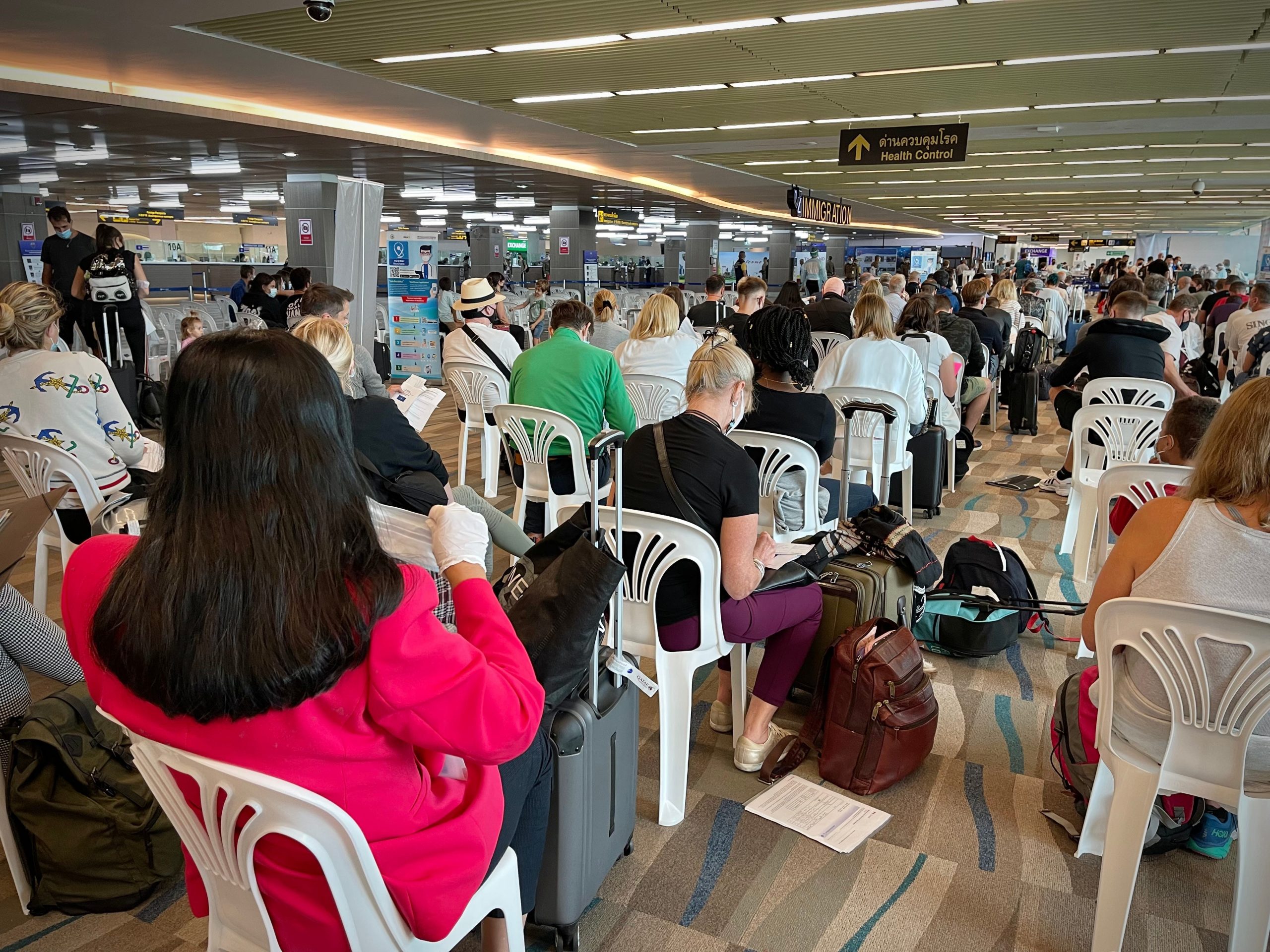 New arrivals at Phuket International Airport wait for screening officials to review entry documentation and to receive a mandatory COVID-19 test Aug. 4, 2021, Phuket, Thailand.