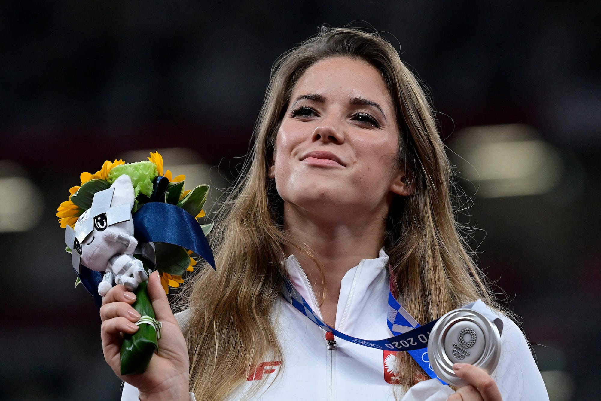 Silver medallist Poland's Maria Andrejczyk celebrates on the podium during the victory ceremony for the women's javelin throw event during the Tokyo 2020 Olympic Games at the Olympic Stadium