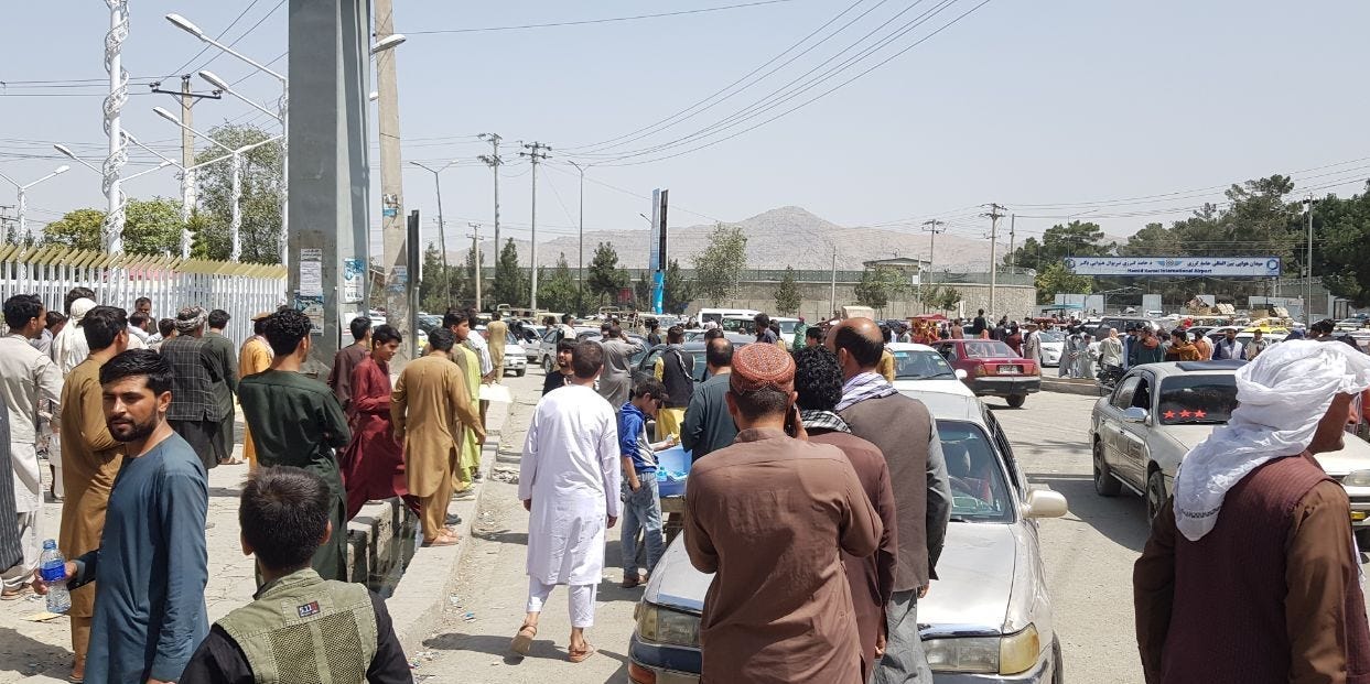 Thousands of Afghans rush to the Kabul International Airport as they try to flee the Afghan capital of Kabul, Afghanistan, on August 17, 2021. (