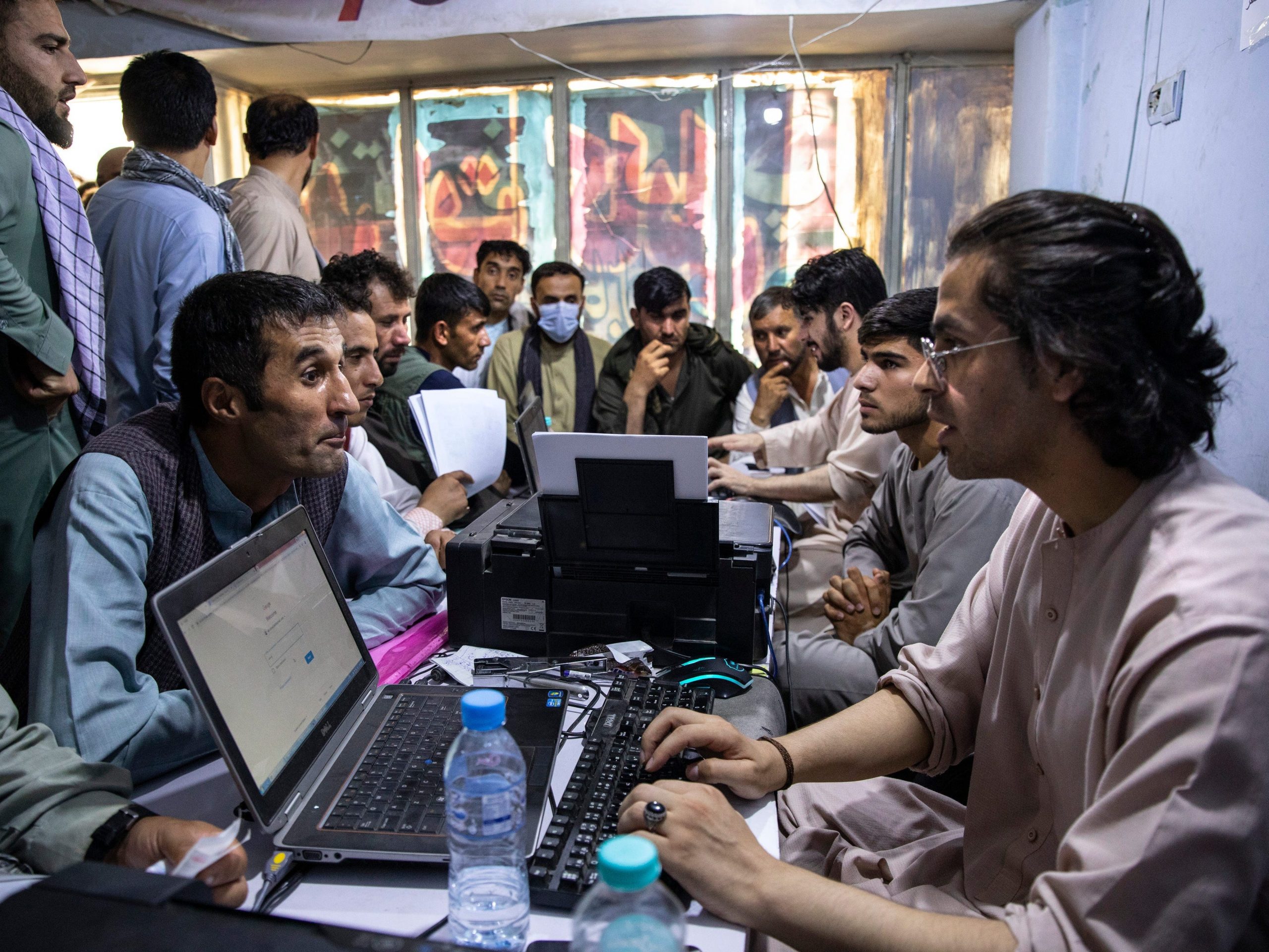 Afghan applicants crowd into the Herat Kabul Internet cafe to apply for the Special Immigrant Visa program on August 8, 2021 in Kabul, Afghanistan.