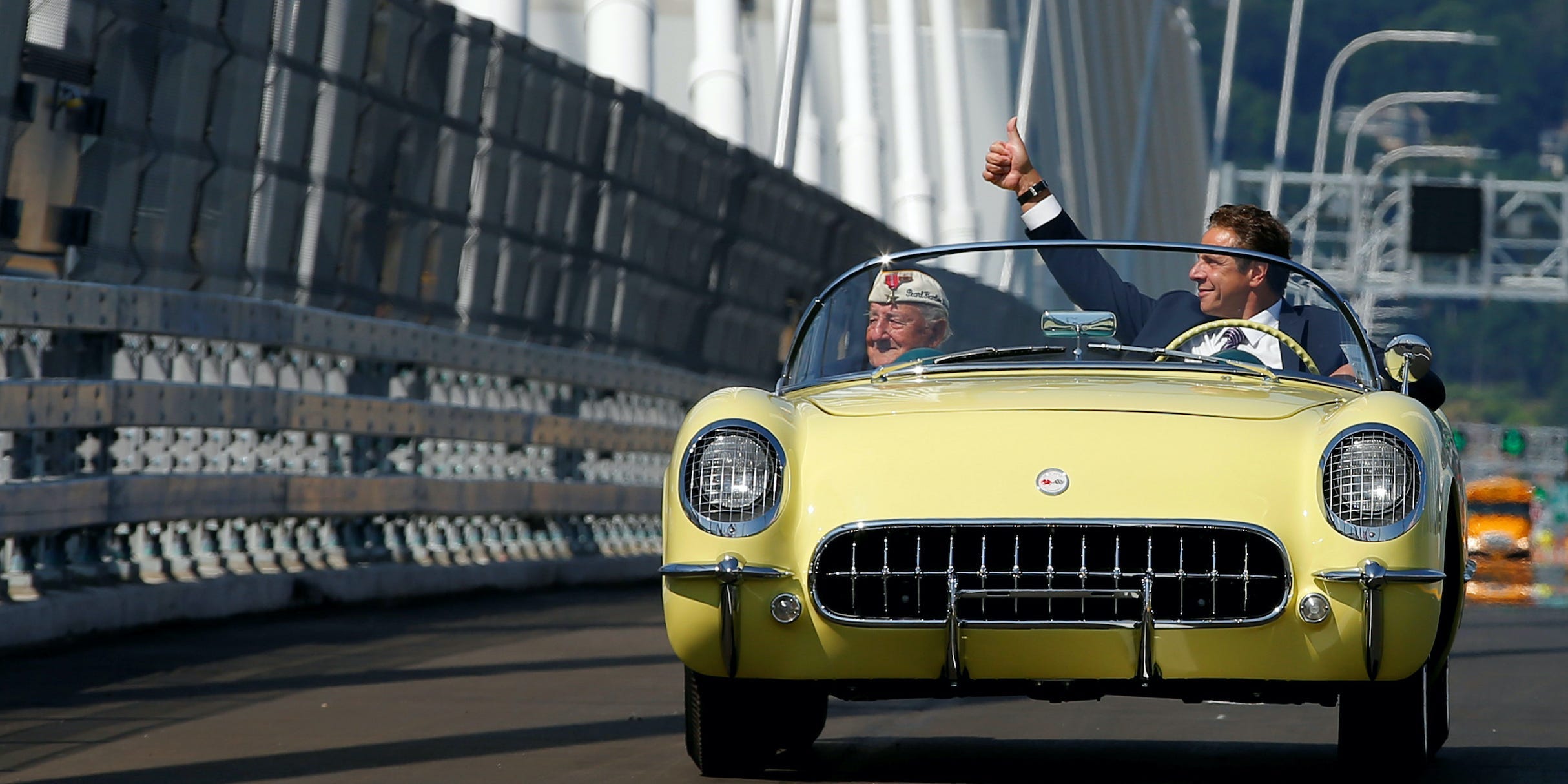 New York governor Andrew Cuomo drives a 1955 Chevrolet Corvette with World War II veteran Armando "Chick" Gallela, during a dedication ceremony for the new Governor Mario M. Cuomo Bridge that is to replace the current Tappan Zee Bridge over the Hudson River in Tarrytown, New York, U.S., August 24, 2017.