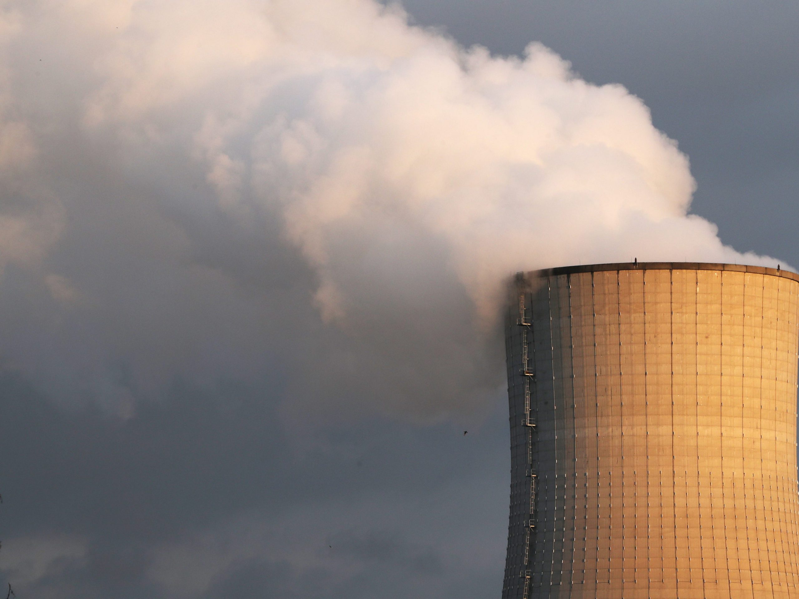 FILE PHOTO: Smoke billows from a chimney at a combined-cycle gas turbine power plant in Drogenbos, near Brussels, Belgium January 30, 2019.  REUTERS/Yves Herman