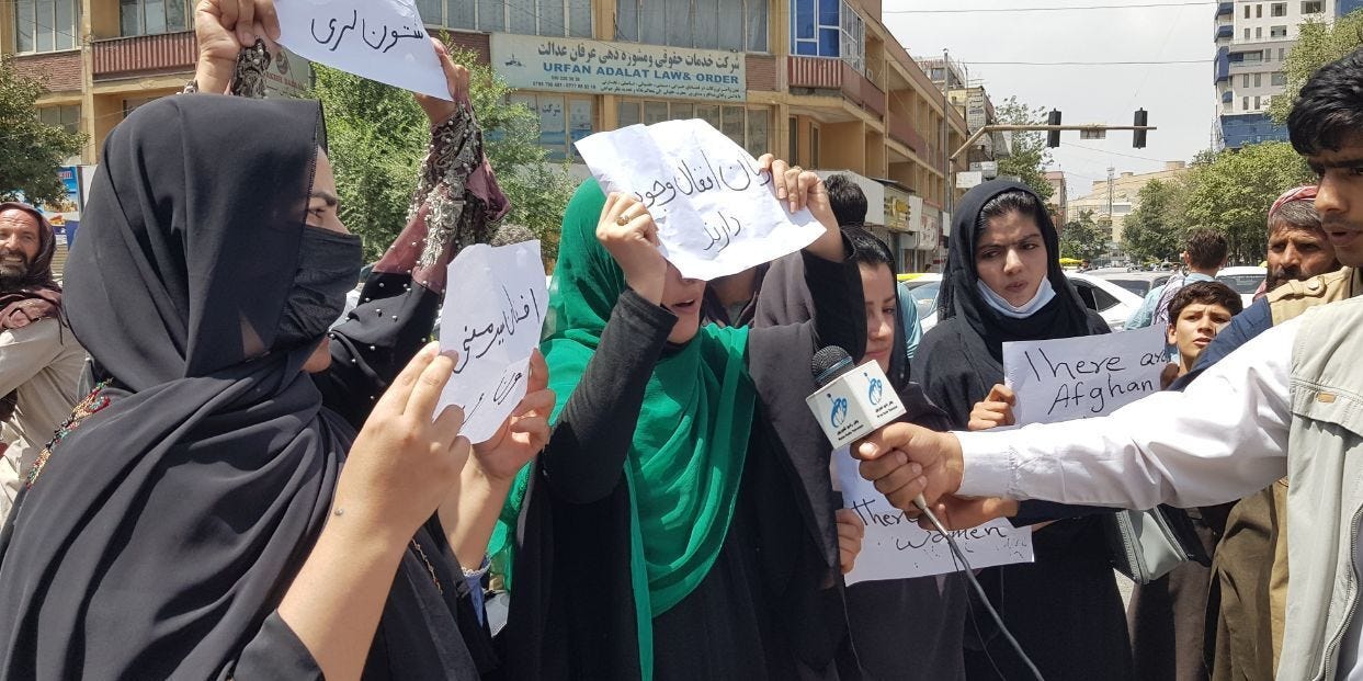 Afghan women, holding placards, gather to demand the protection of Afghan women's rights in front of the Presidential Palace in Kabul, Afghanistan on August 17, 2021.