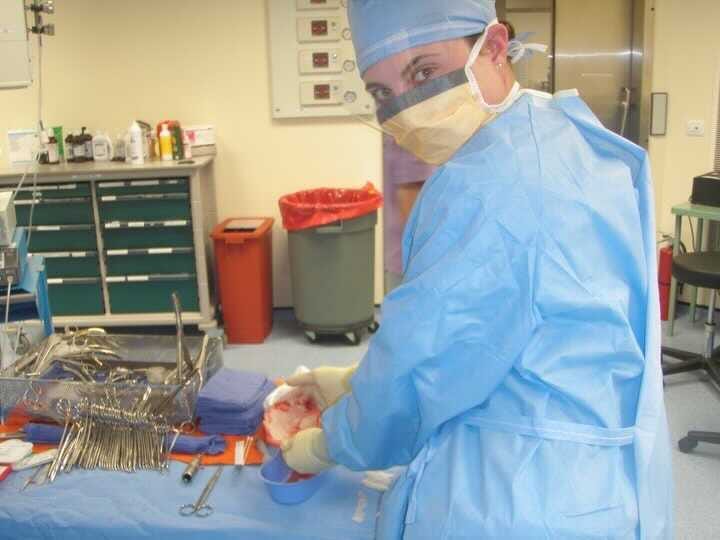 Jen Burch dressed in scrubs while serving as a volunteer medic in Afghanistan.