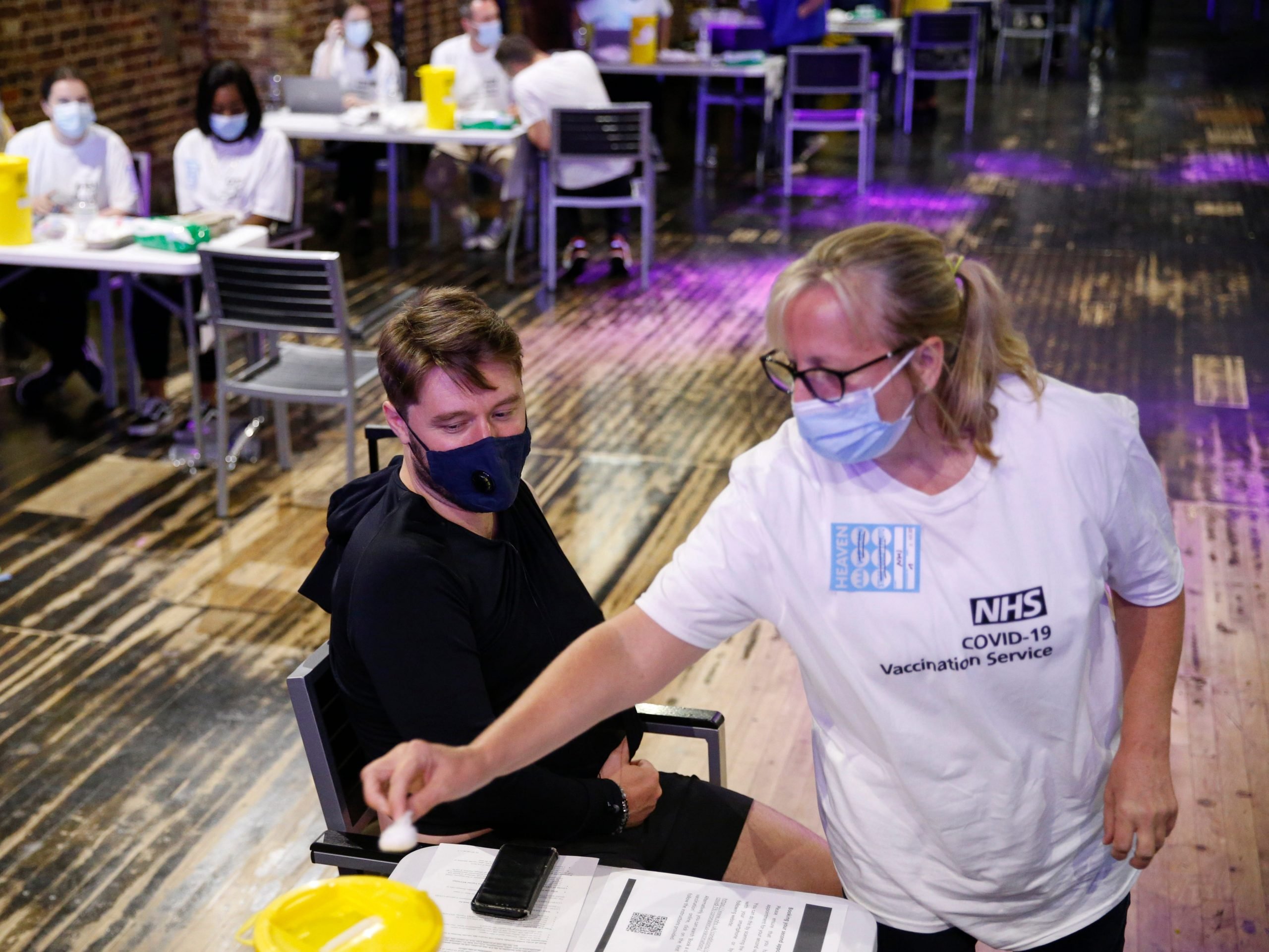 A man receives a dose of the Pfizer vaccine at an NHS Covid-19 vaccination centre hosted at the nightclub Heaven on August 8, 2021 in London, England.