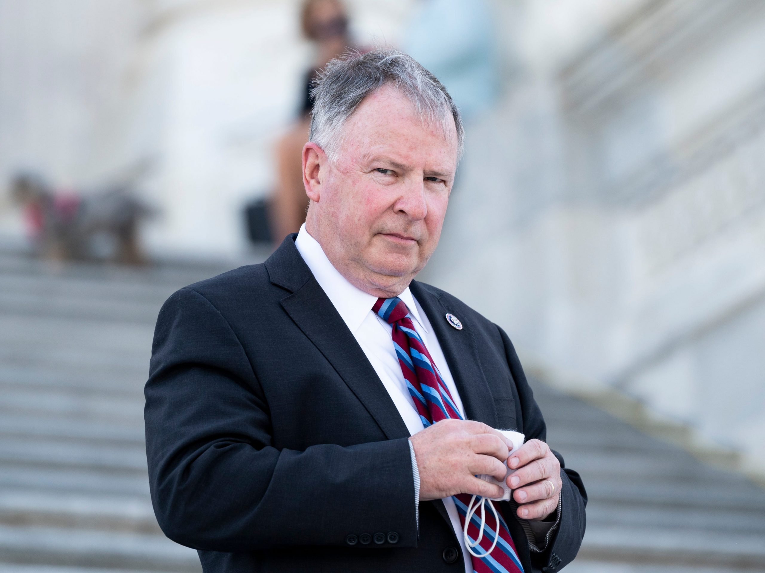 Rep. Doug Lamborn walks down the House steps of the Capitol after a vote on April 20, 2021.