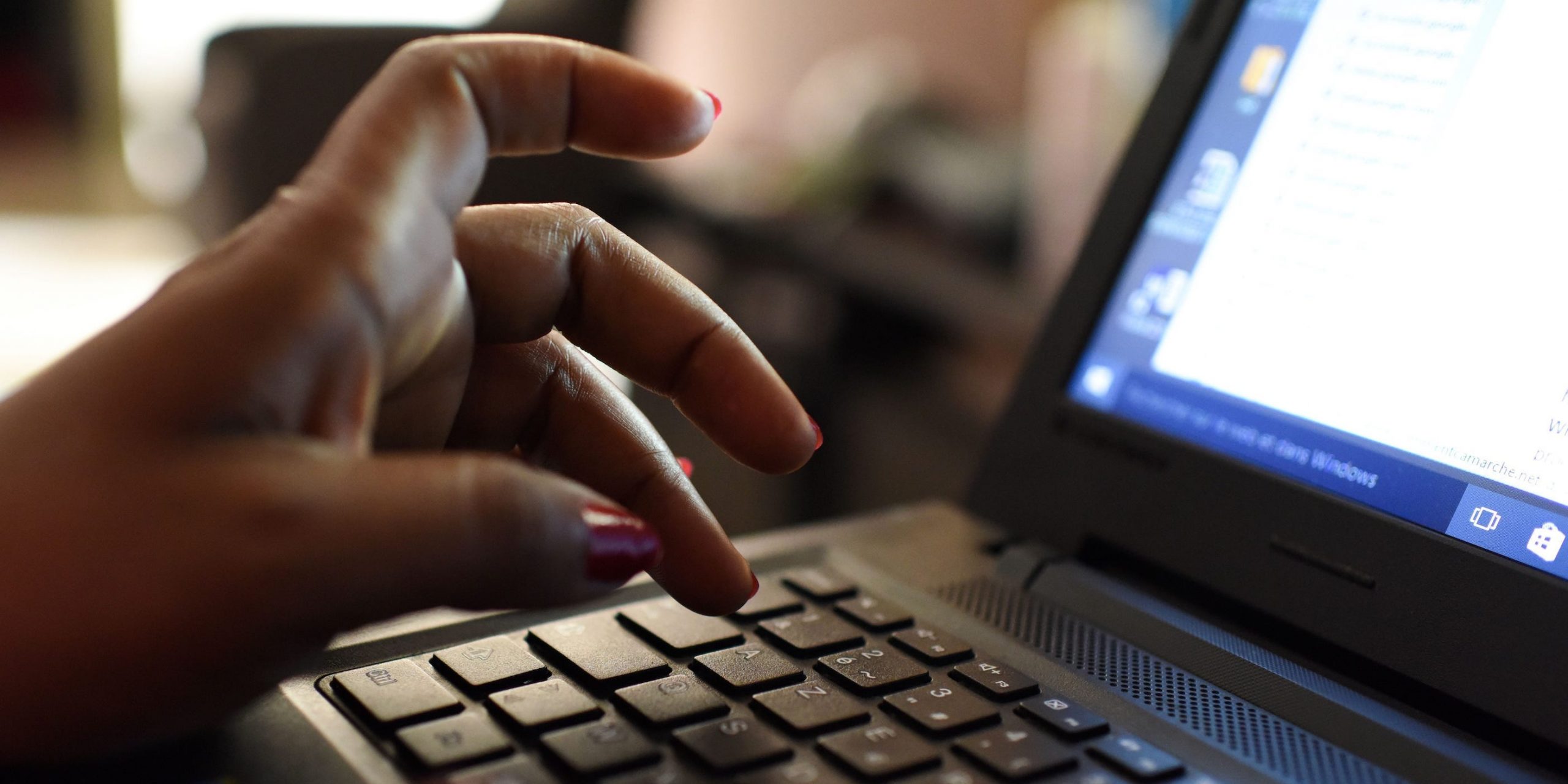 woman uses laptop