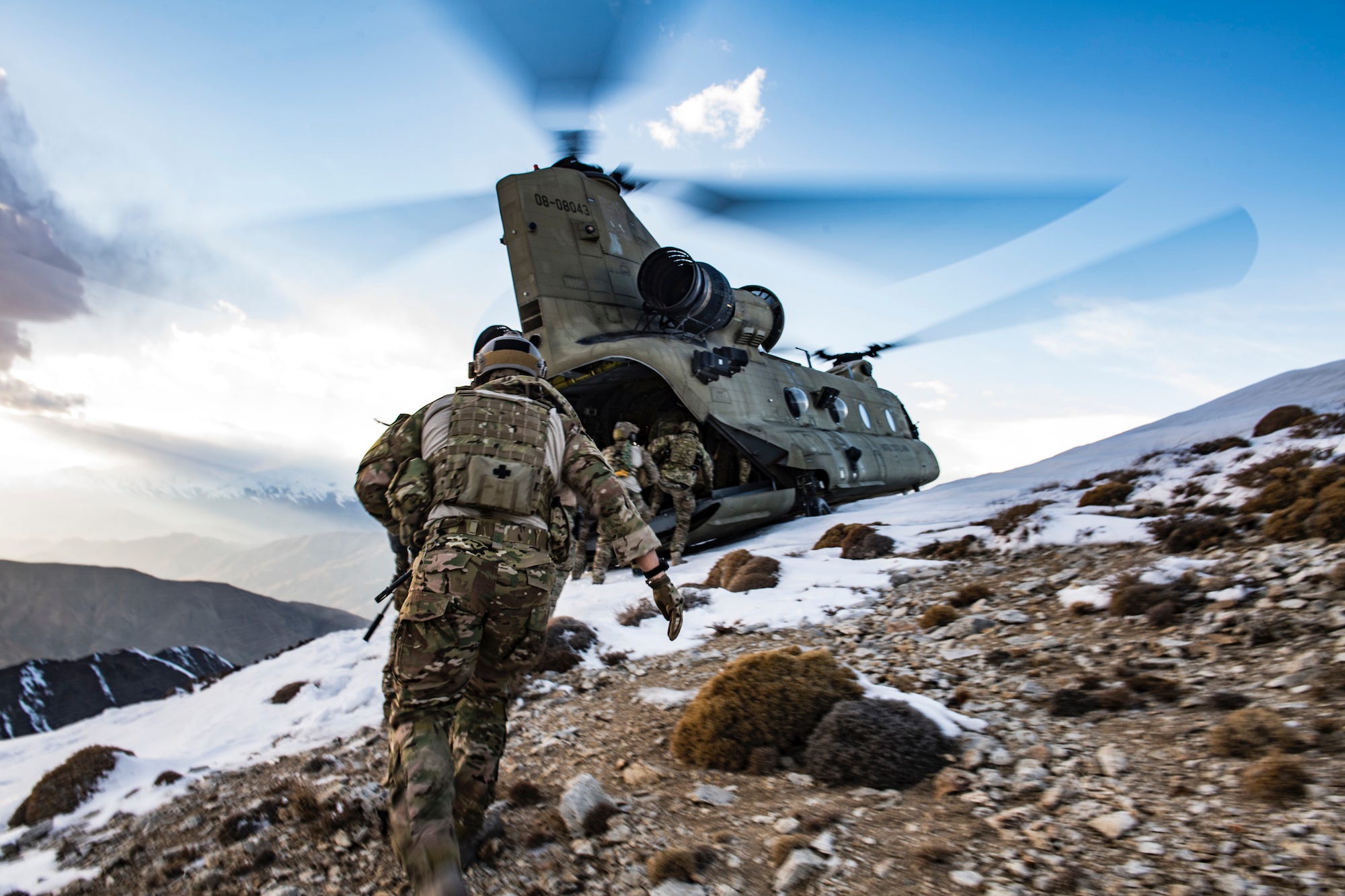 US Air Force pararescuemen board US Army CH-47F Chinook helicopter