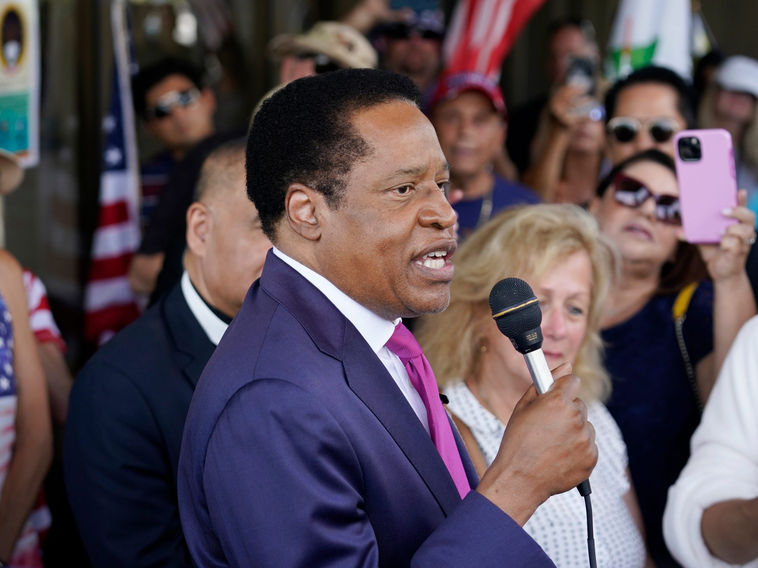 FILE - In this July 13, 2021, file photo, conservative radio talk show host Larry Elder speaks to supporters during a campaign stop in Norwalk, Calif. Elder was not on the list of candidates released Saturday in the recall election that could end the term of California Gov. Gavin Newsom.