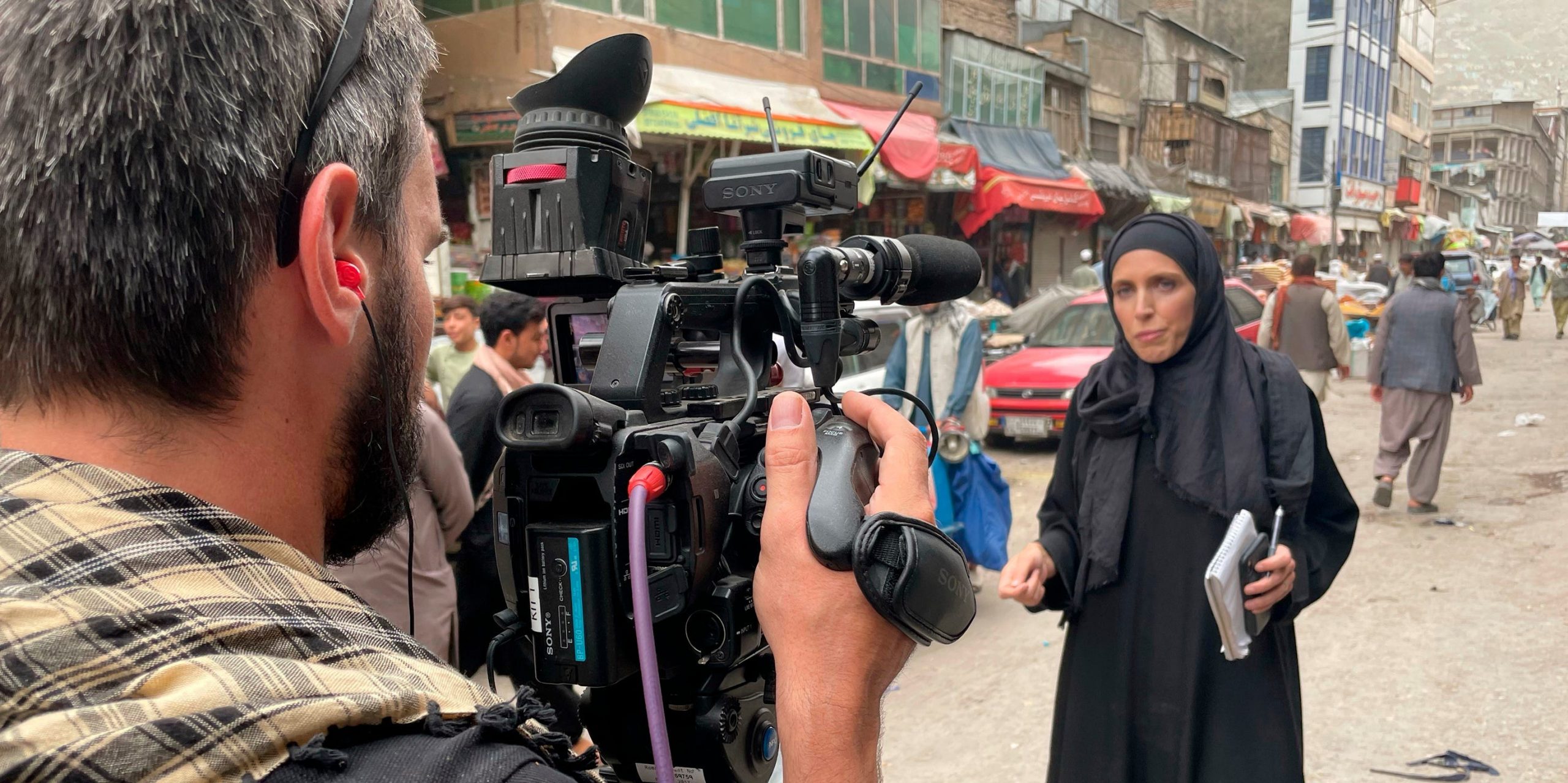 A camera pointed a CNN's Clarissa Ward on a Kabul street