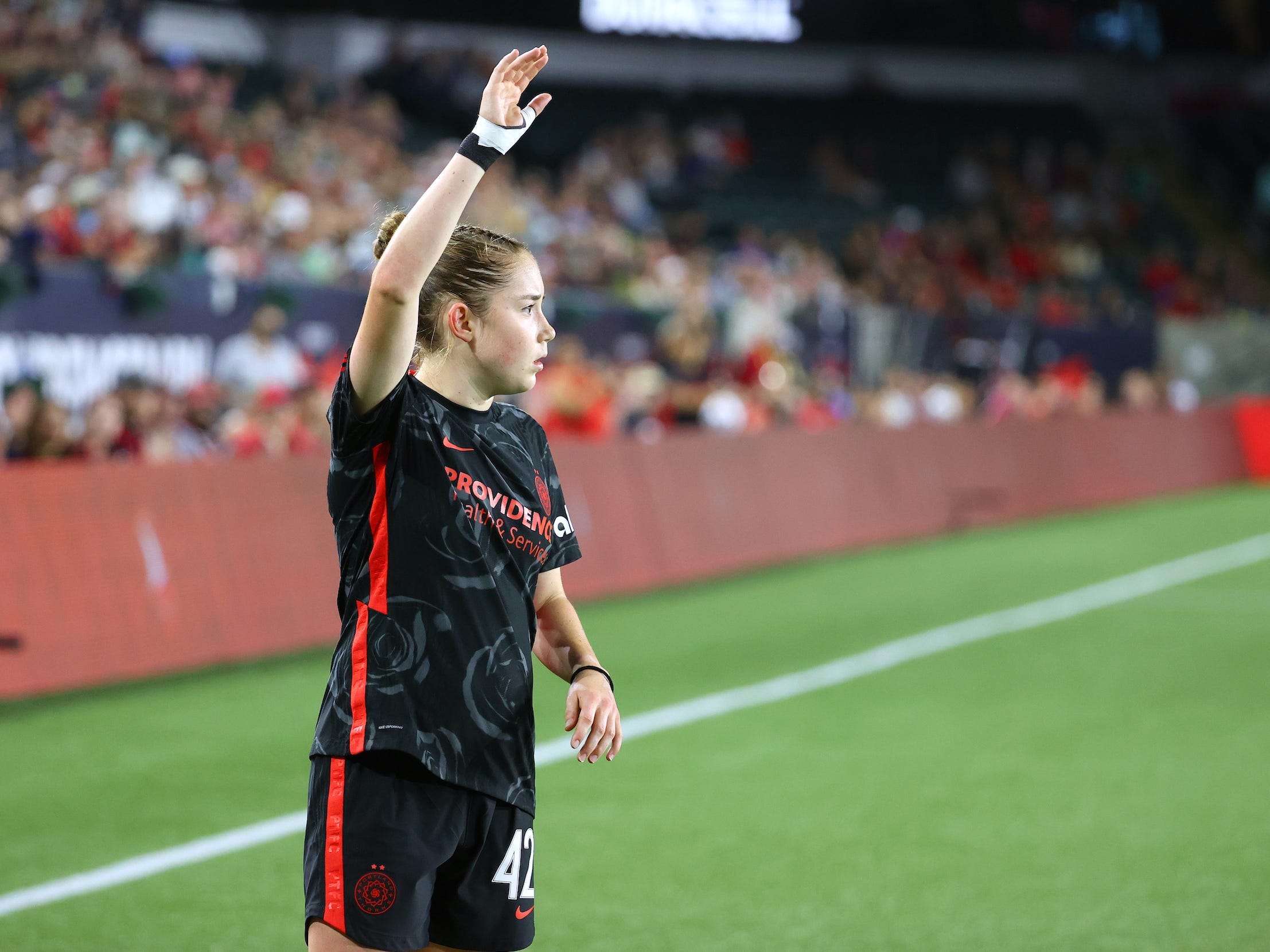 Olivia Moultrie takes a free kick for the Portland Thorns.