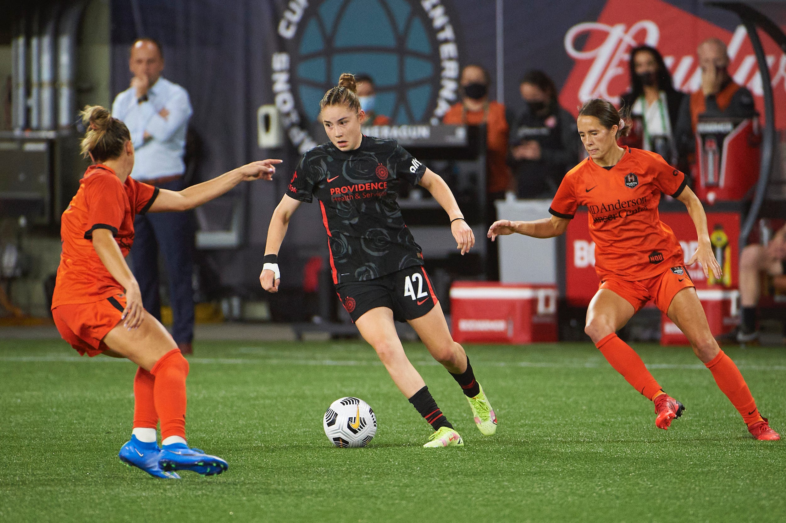 Olivia Moultrie dribbles for the Portland Thorns.