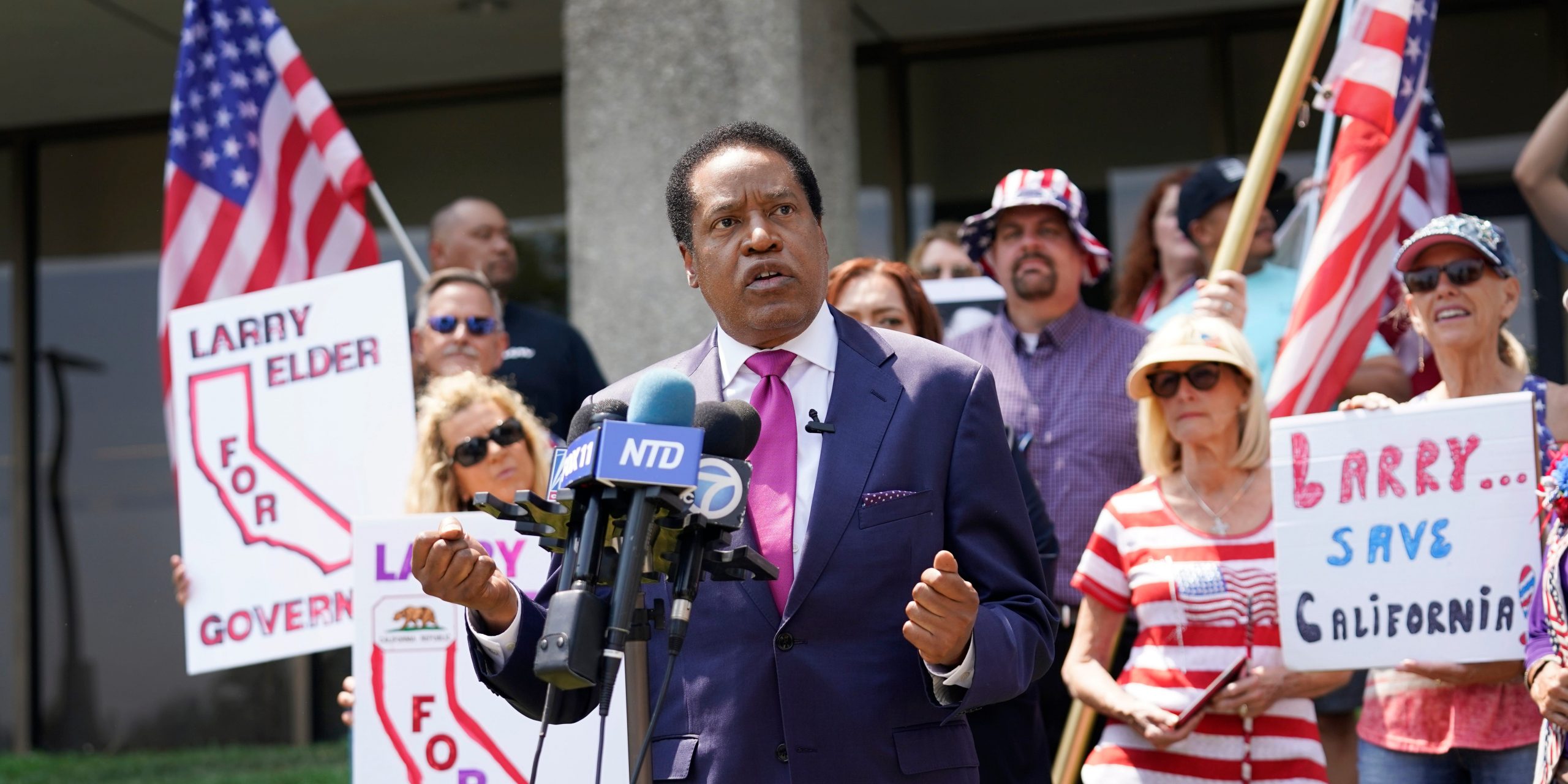 In this July 13, 2021 file photo radio talk show host Larry Elder speaks to supporters during a campaign stop in Norwalk, Calif.