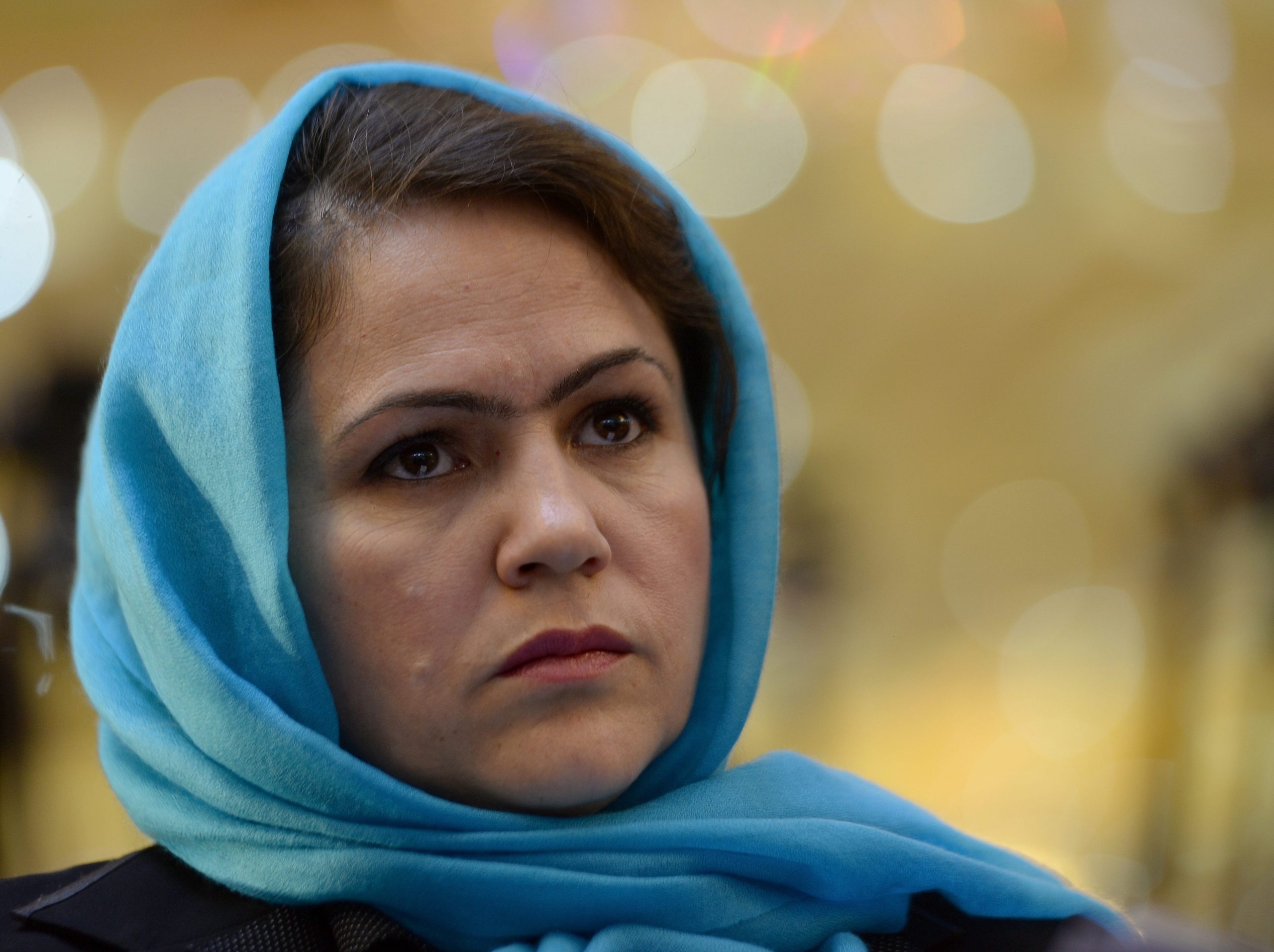 Afghan member of parliament Fawzia Kofi looks on as she attends a political gathering at a wedding hall in Kabul on September 26, 2013.