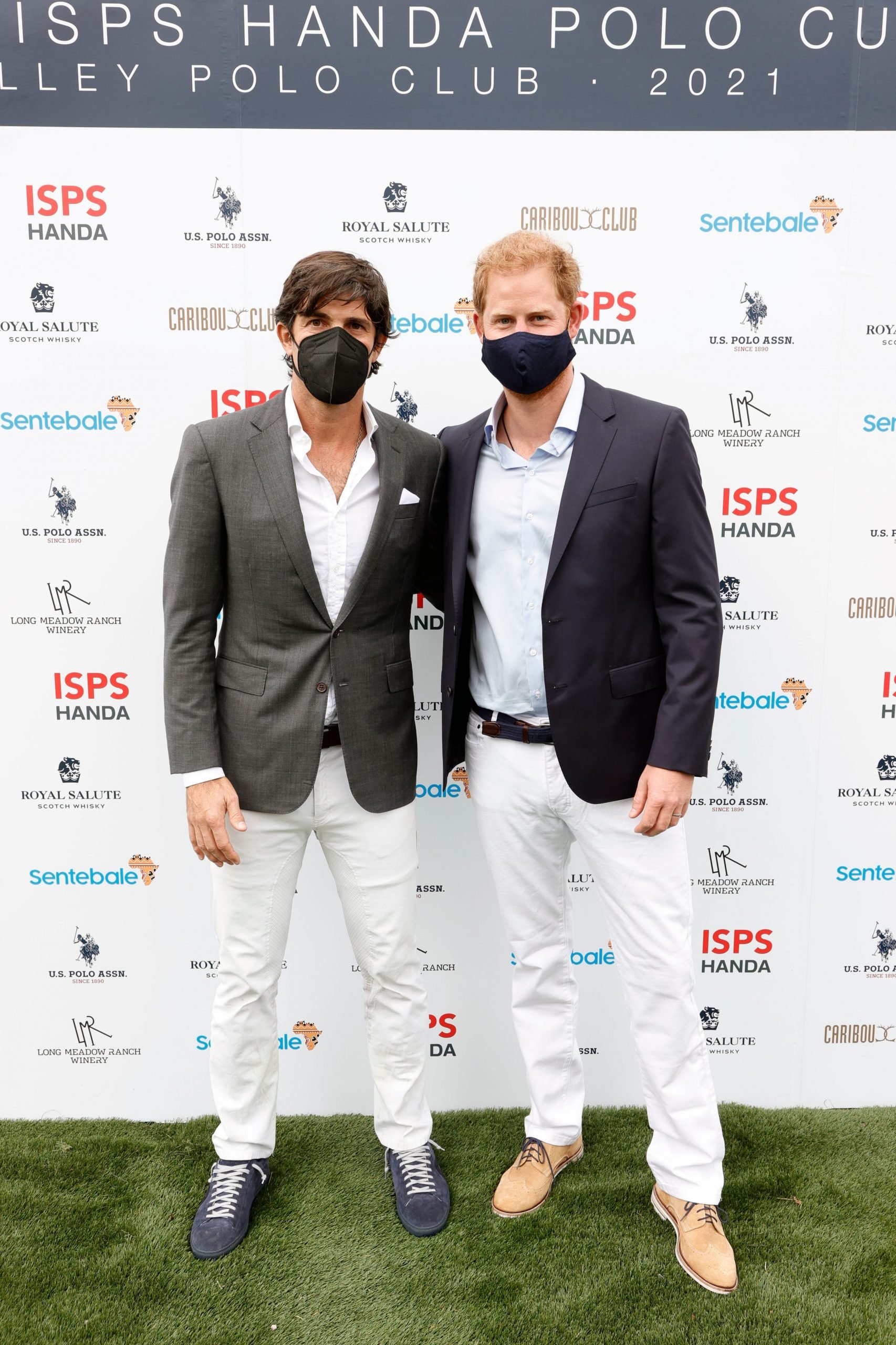 Prince Harry pictured with Nacho Figueras posing for a photograph at the Sentable charity polo match.