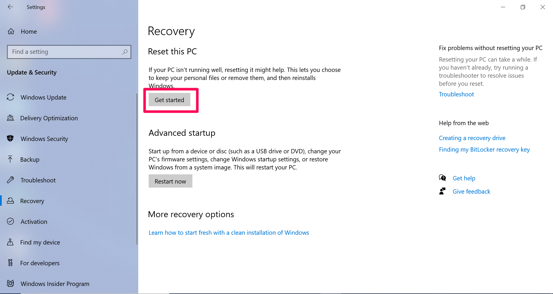 A screenshot of the Windows 10 Recovery menu with a box around the Reset this PC "Get Started" button.