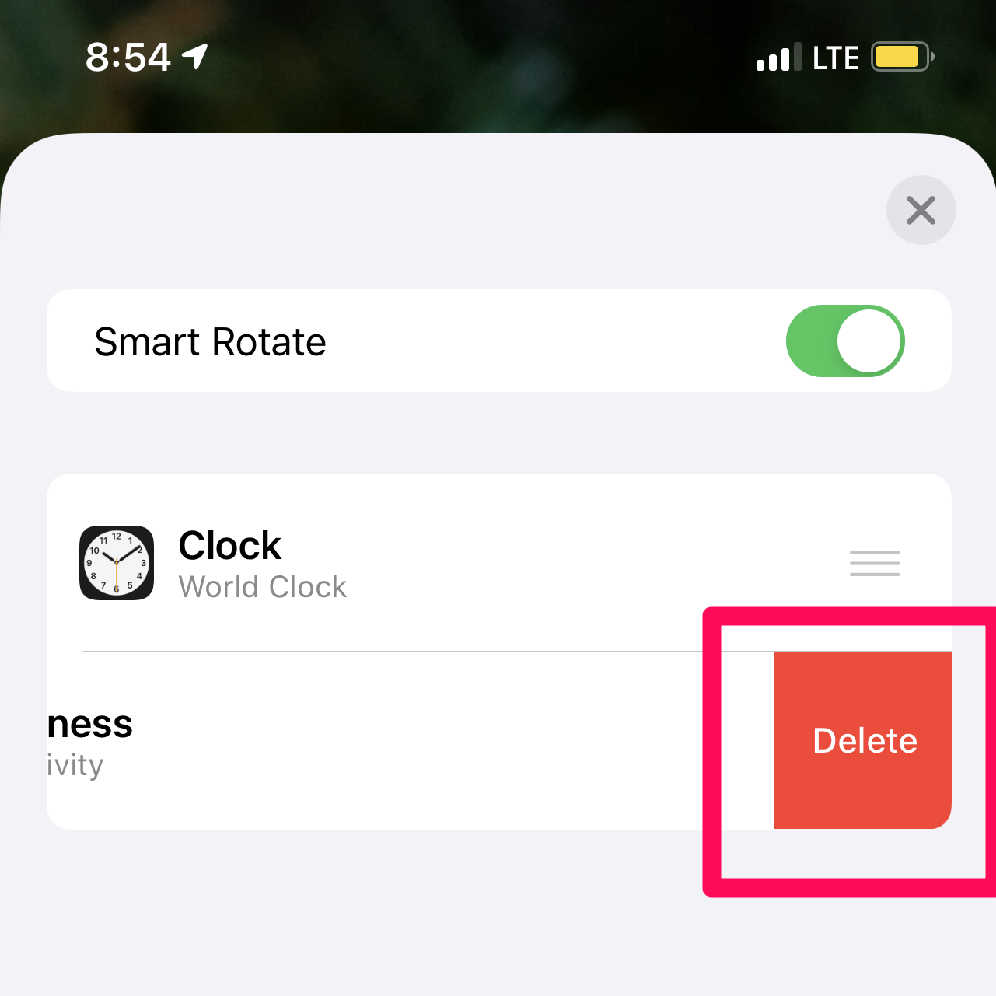 A screenshot of an iPhone edit Smart Stack screen with an app swiped to the left to show the Delete button with a box around the button.