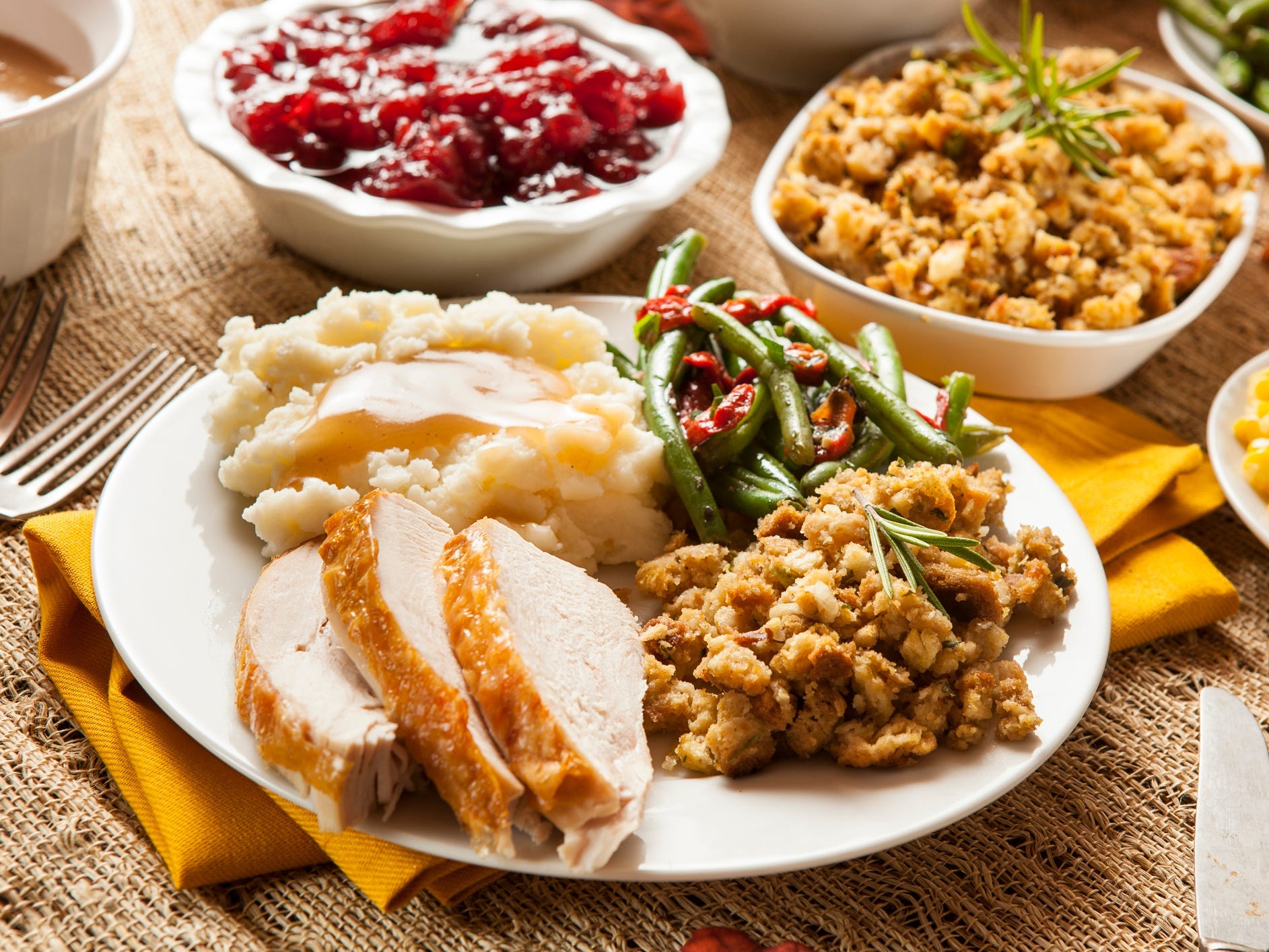 A classic Thanksgiving dinner with spiced turkey, stuffing, mashed potatoes, and green beans