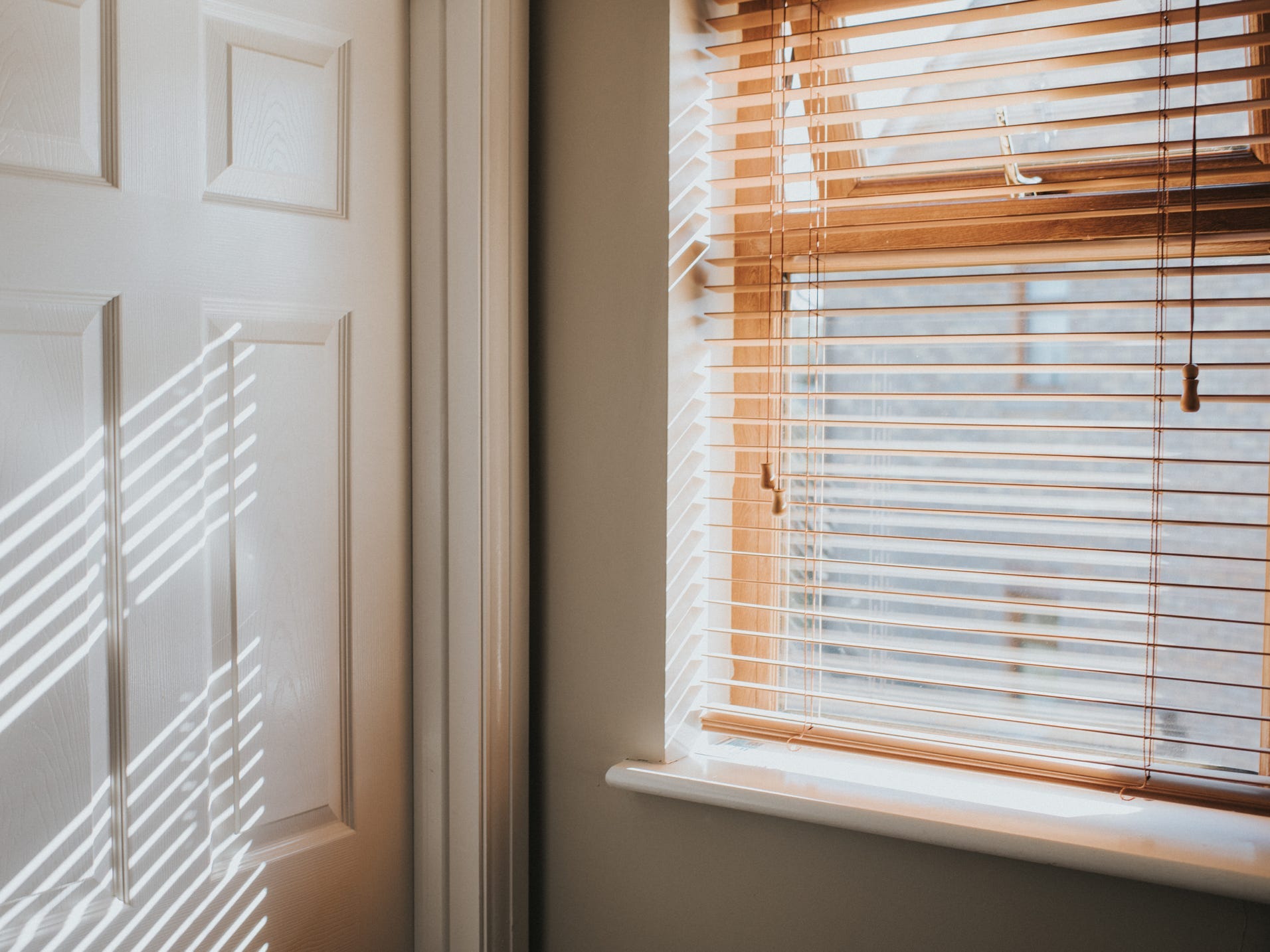 Light coming through window blinds.