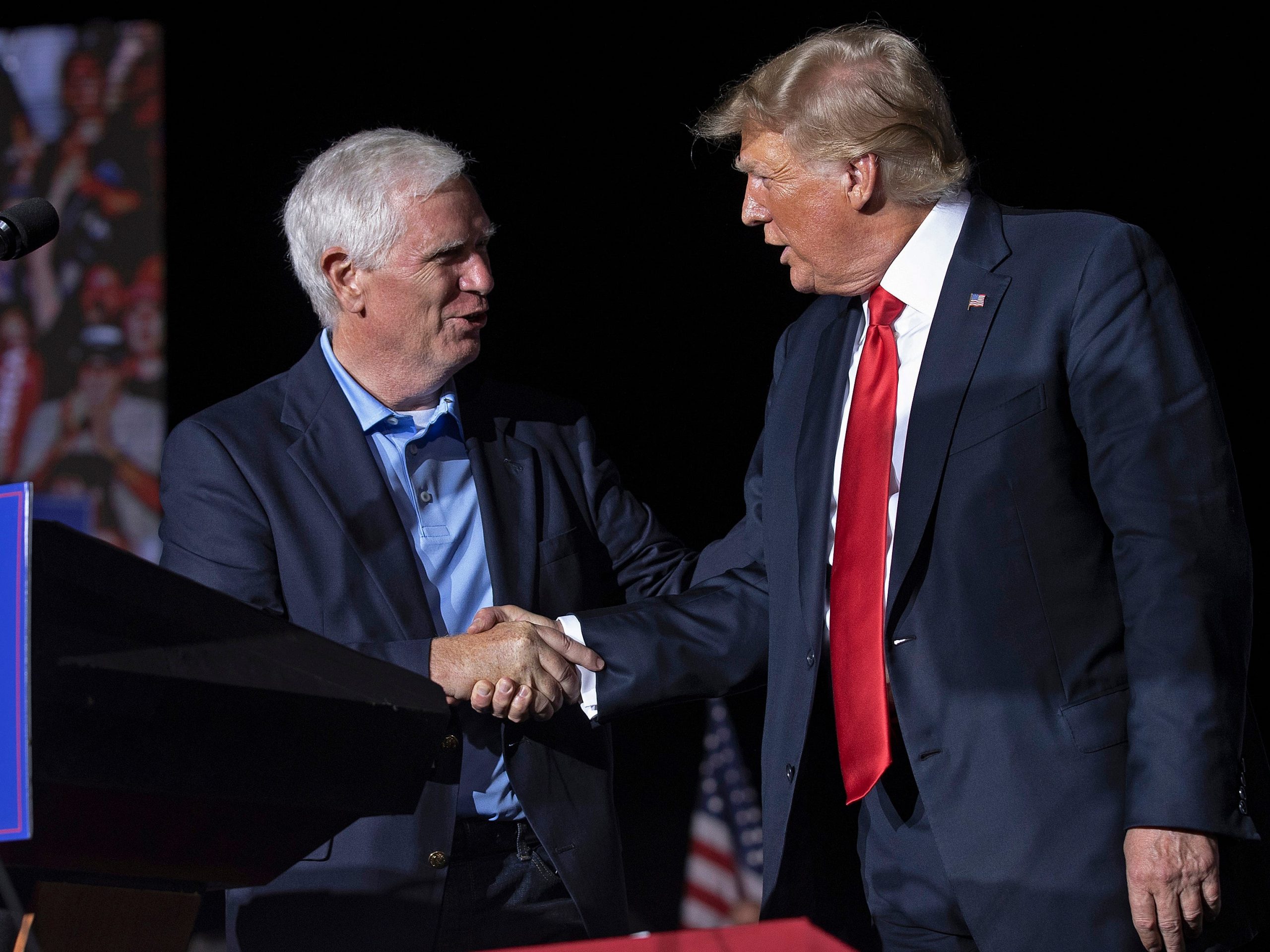 Former U.S. President Donald Trump (R) welcomes candidate for U.S. Senate and U.S. Rep. Mo Brooks (R-AL) to the stage during a "Save America" rally at York Family Farms on August 21, 2021 in Cullman, Alabama.