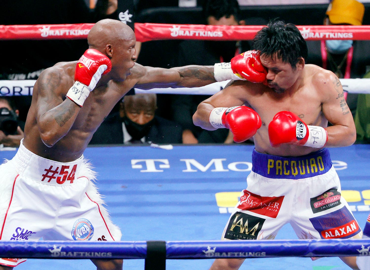 Yordenis Ugas punches Manny Pacquiao en route to his comfortable decision win in Las Vegas.